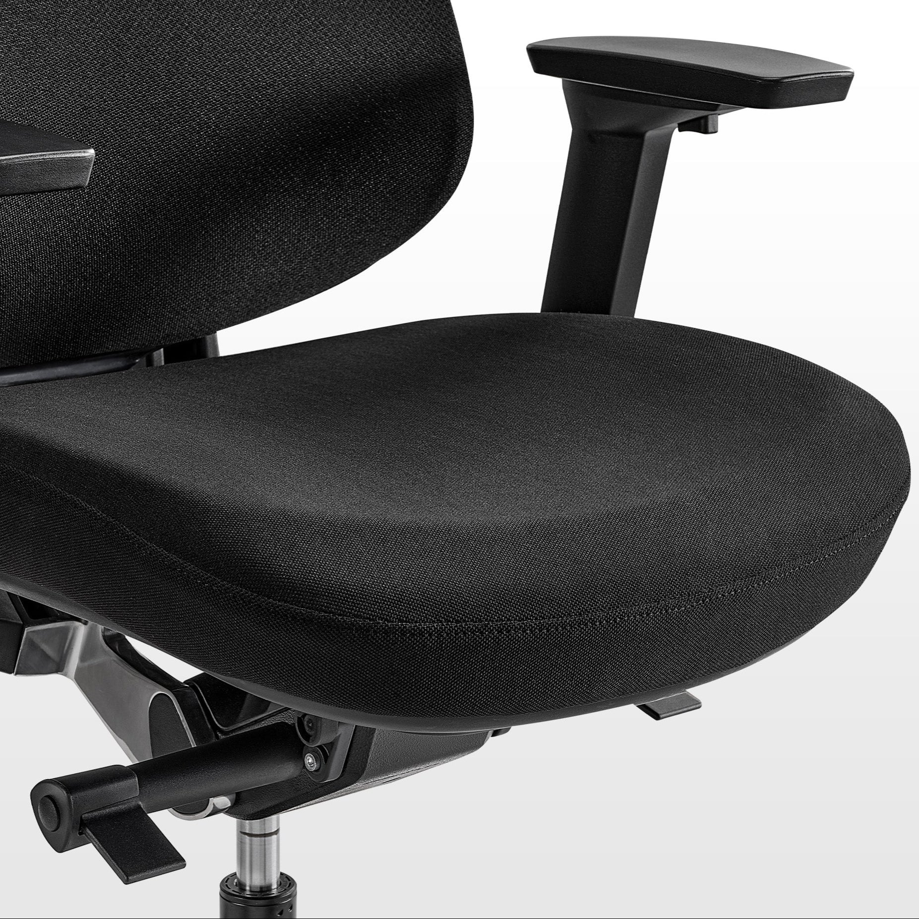 Eureka Ergonomic Lira black ergonomic office chair close-up: textured fabric seat, armrest, and adjustment levers visible.