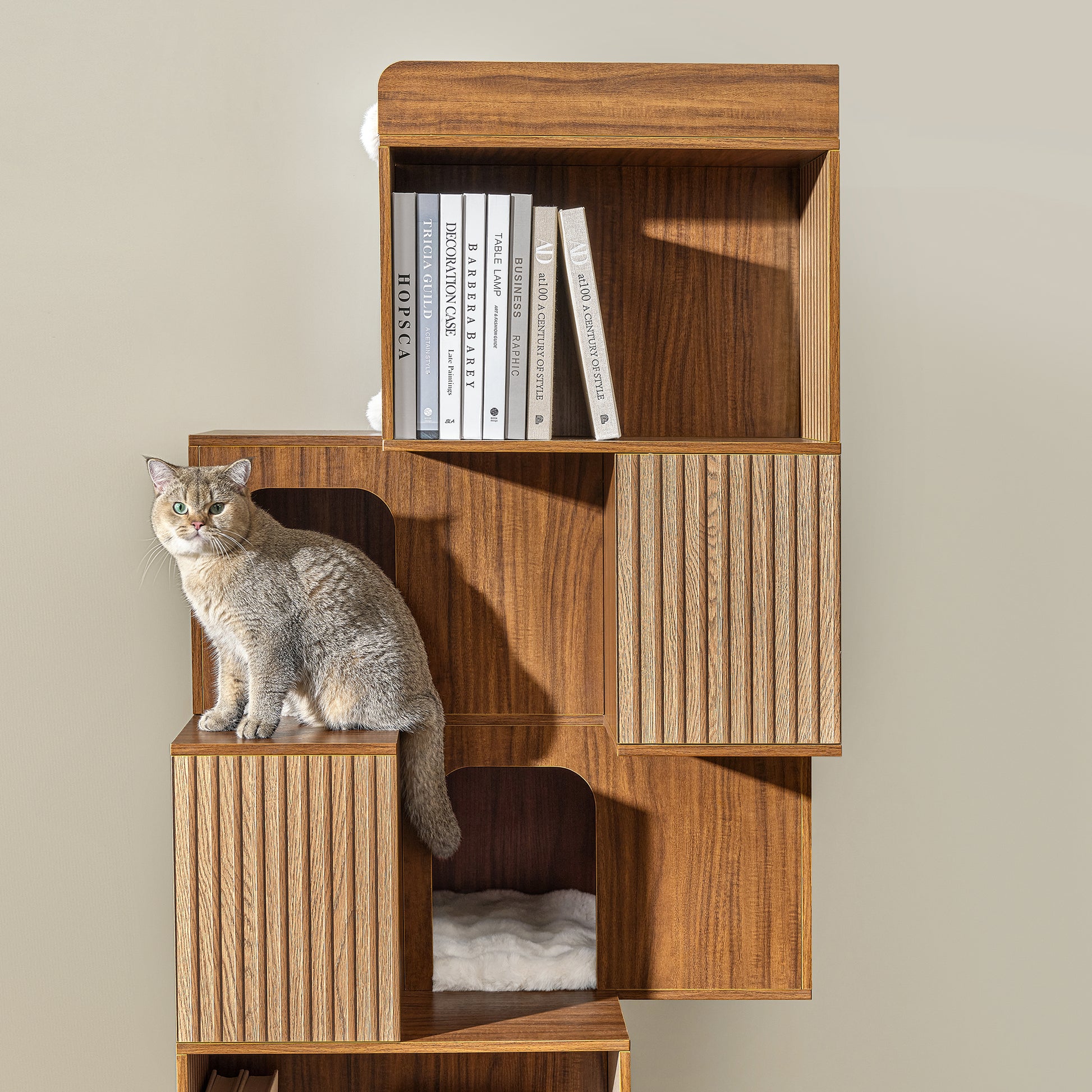 Eureka Ergonomic Golden cat relaxing on Pawlio 72" bookshelf cat tree with ribbed wood panels and plush cubby bed.