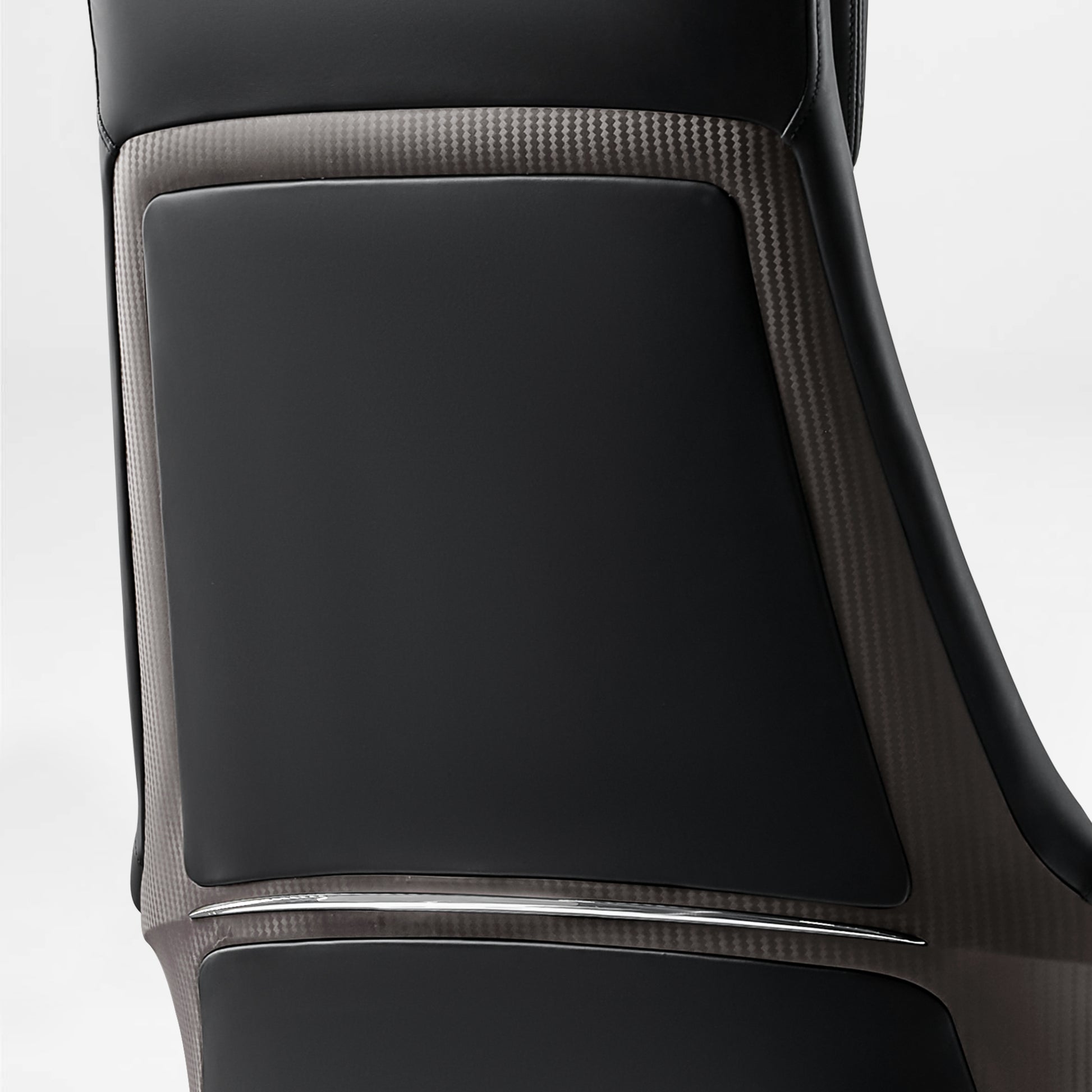 Eureka Ergonomic Royal Renee executive chair back detail with microfiber leather, carbon fiber accent, and chrome strip.