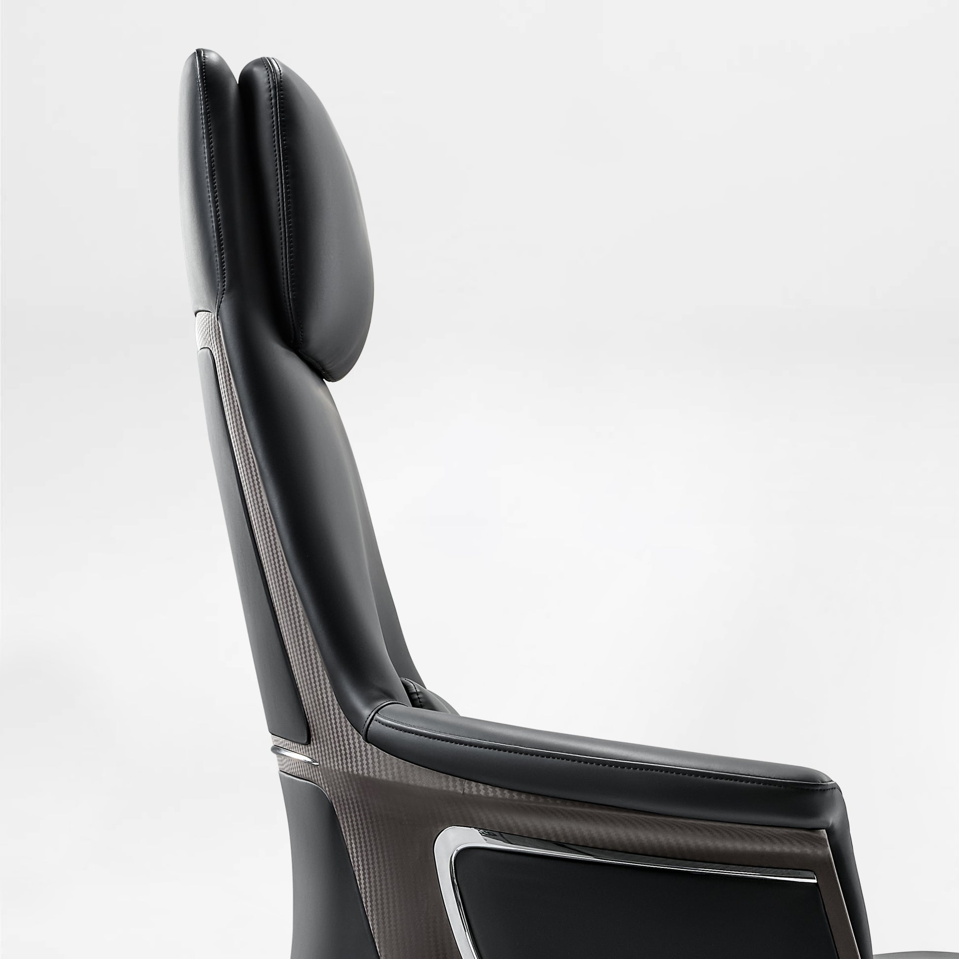 Eureka Ergonomic Black Royal Renee executive chair headrest and back detail with carbon fiber accent and chrome trim.
