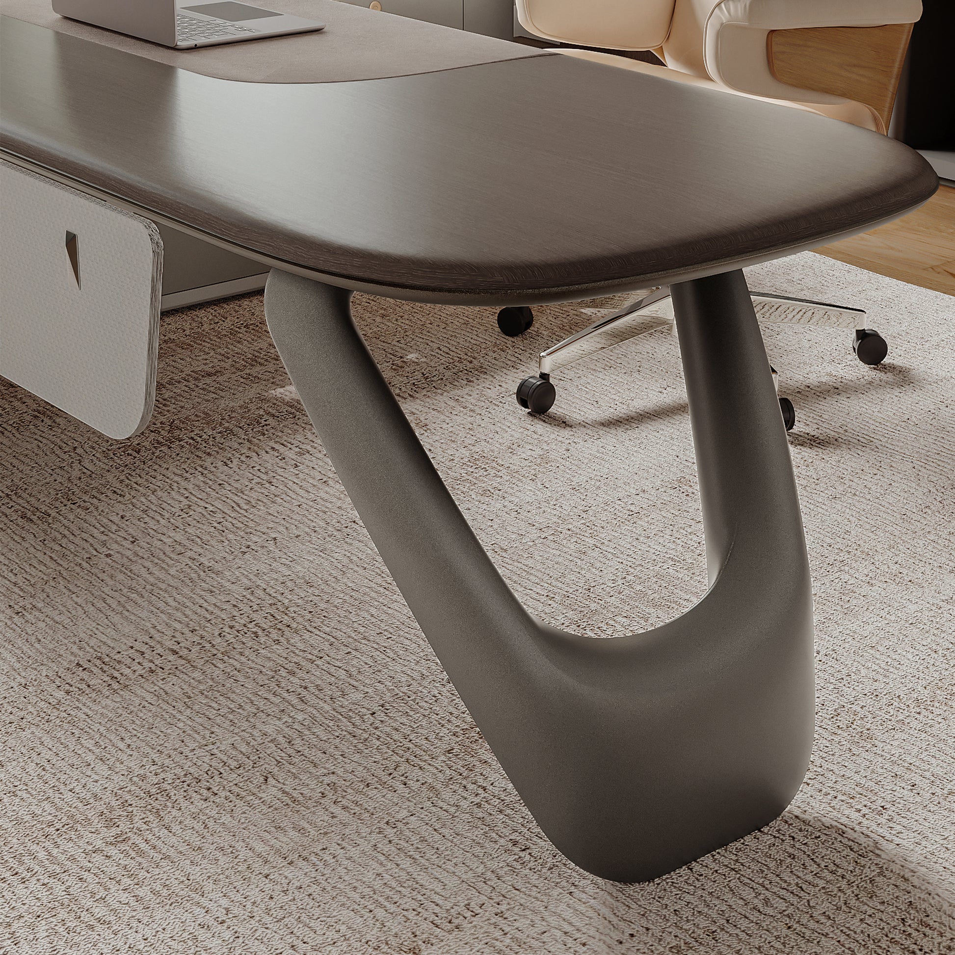 Eureka Ergonomic Zen Orion executive desk close-up: dark gray textured finish, elliptical wood-grain top, curved metallic leg.