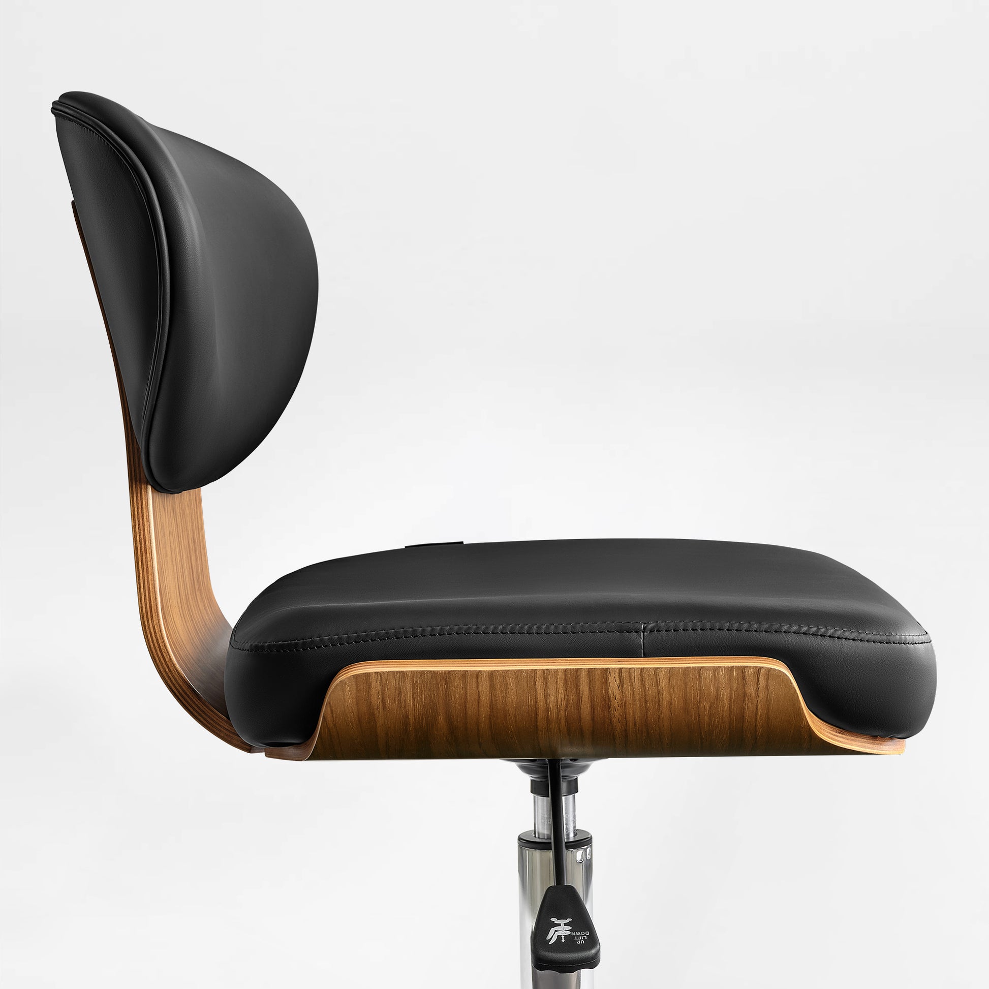 Eureka Ergonomic Black faux leather office chair seat with stitched detail and curved walnut veneer shell.