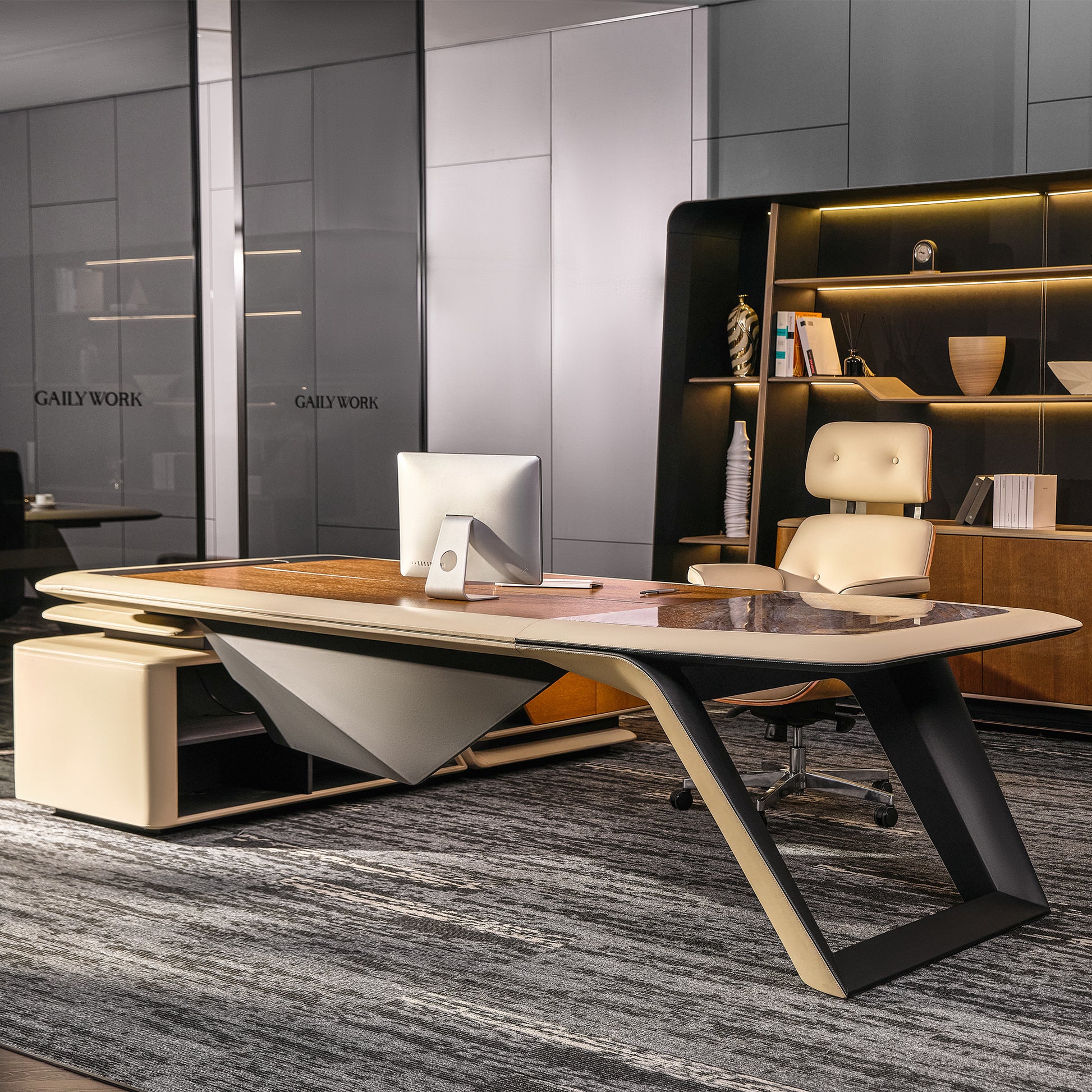 Eureka Ergonomic Zen Lunar executive desk with wood grain, marble inlay, and beige border, paired with chair and illuminated bookcase.