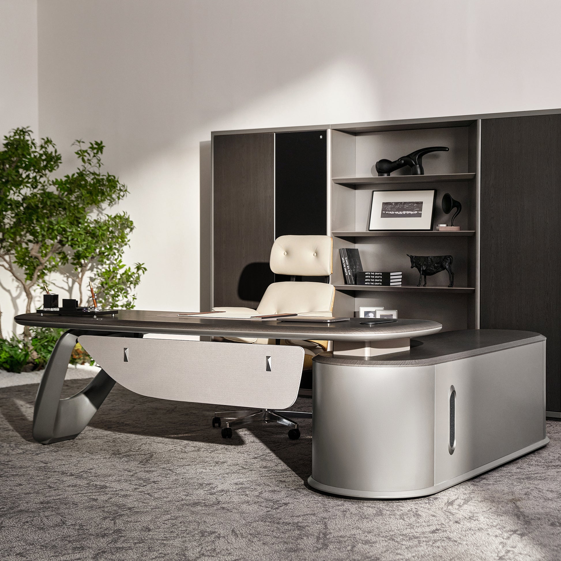 Eureka Ergonomic Zen Orion executive desk and bookcase set. Dark gray textured finish, wood grain, curved metallic legs, cream chair.