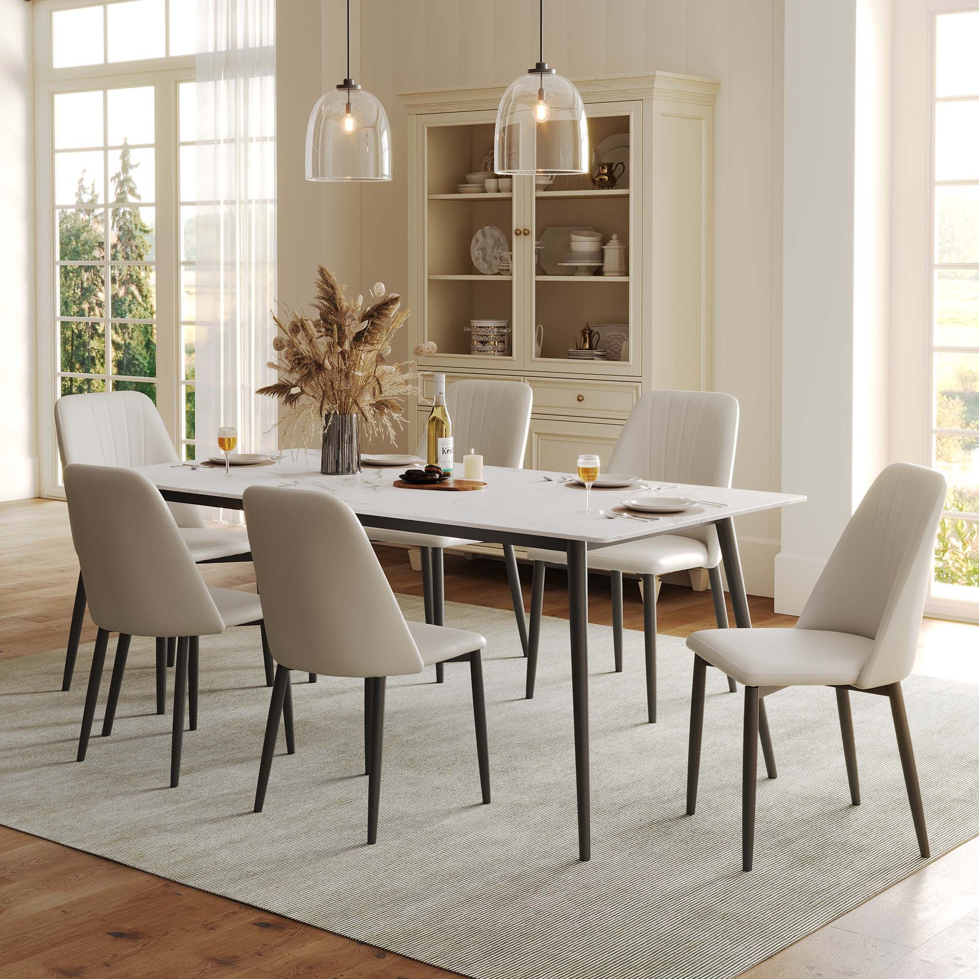 Off-White Upholstered Dining Chairs Around a Modern Dining Table in a Bright Dining Room.