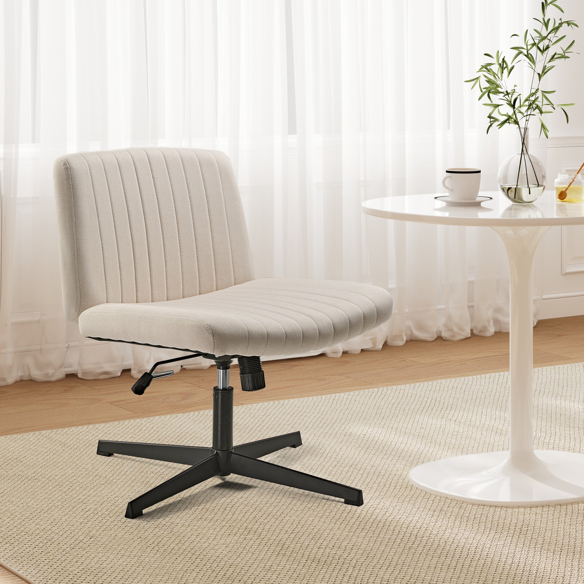 Adena Swivel Lounge Chair in Cream Linen-Blend Fabric, Ergonomic Design, Black Base, in a Bright Living Space.