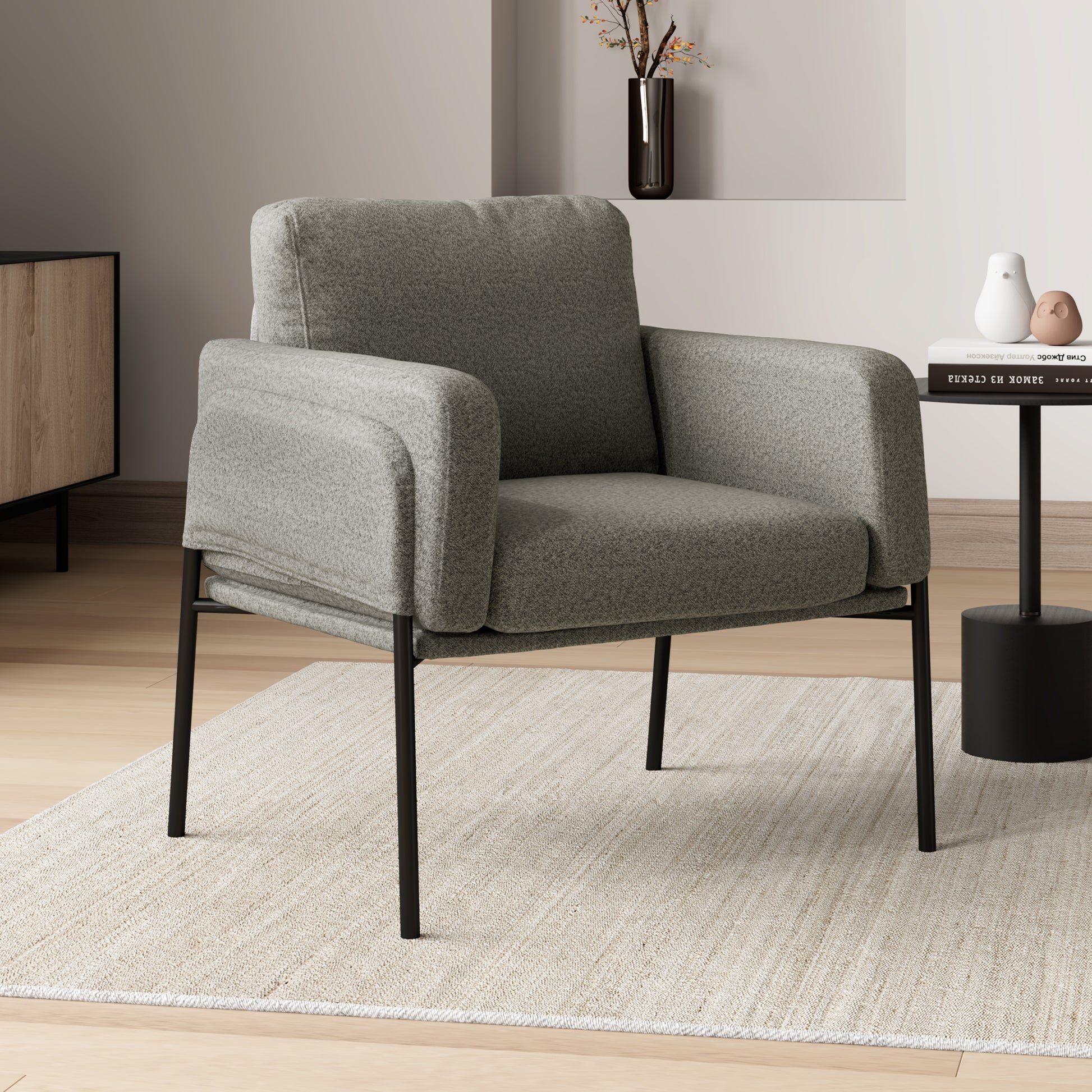 Weston Ant Fabric Lounge Chair in Gray With Black Metal Legs, On a Beige Rug, Modern Living Room Decor.