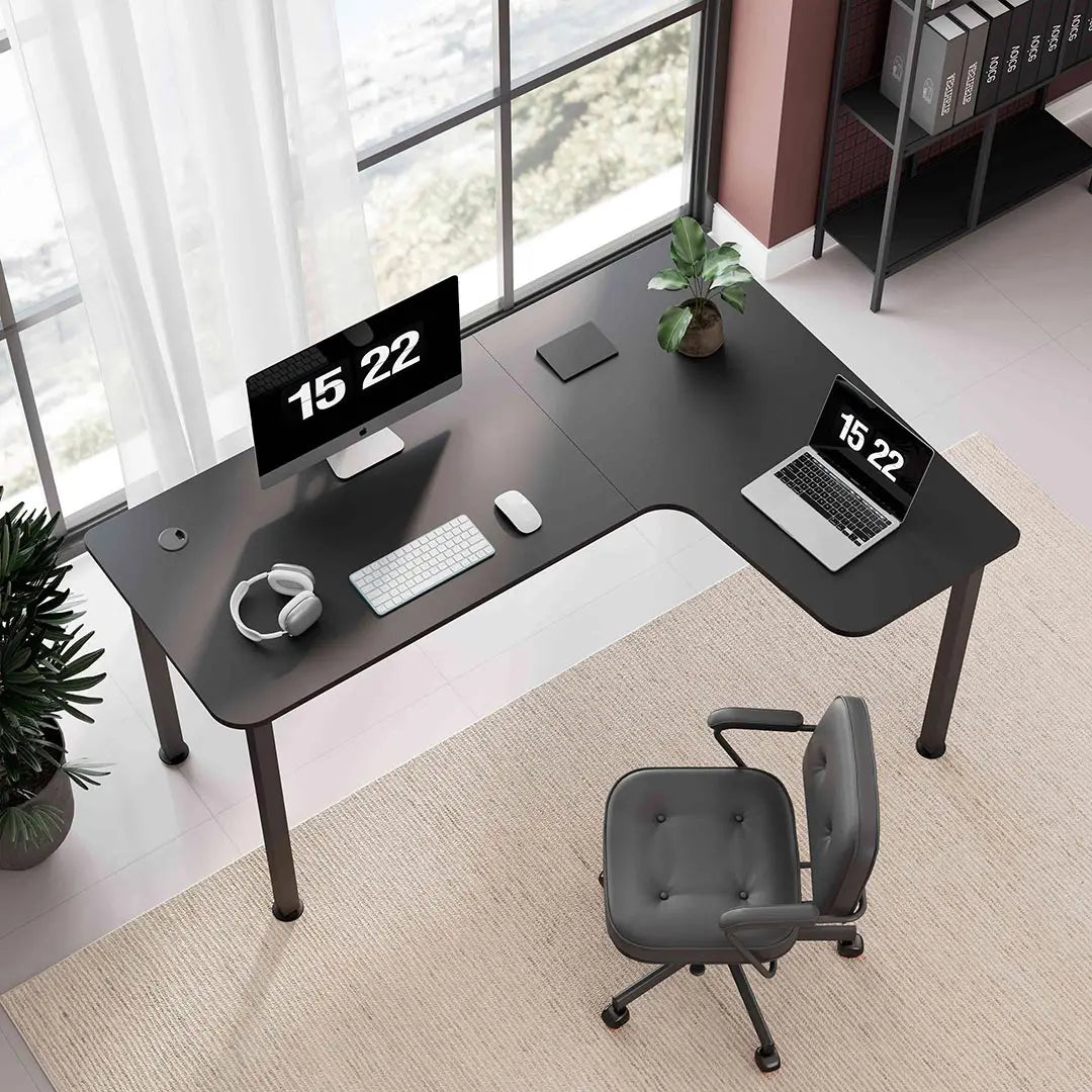 Eureka Ergonomic Black L-Shaped Gaming Desk Setup With Triple Monitors and Ergonomic Chair.
