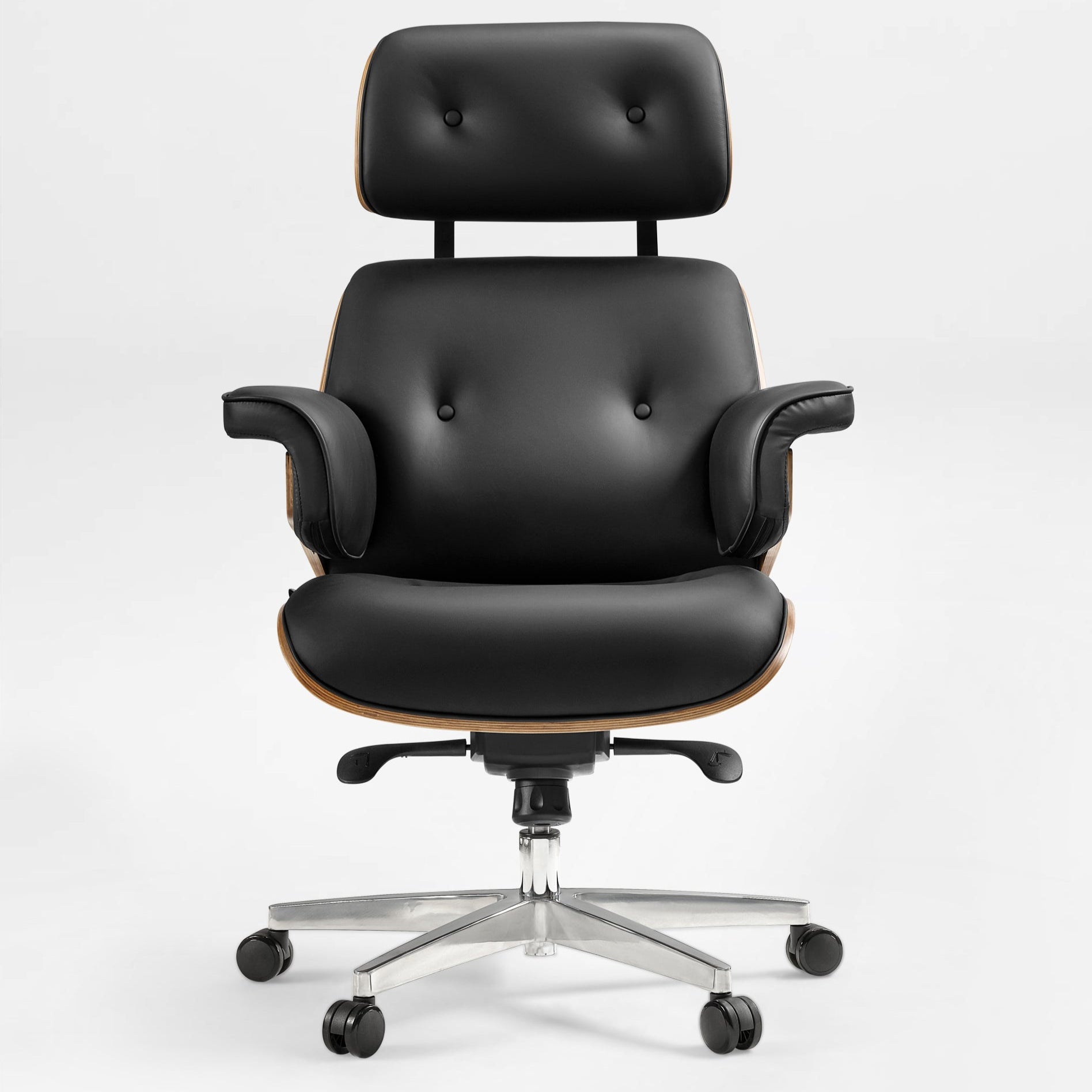 Eureka Ergonomic Mathias black Napa leather executive office chair with button tufting and wood veneer accents on a silver five-wheel base.