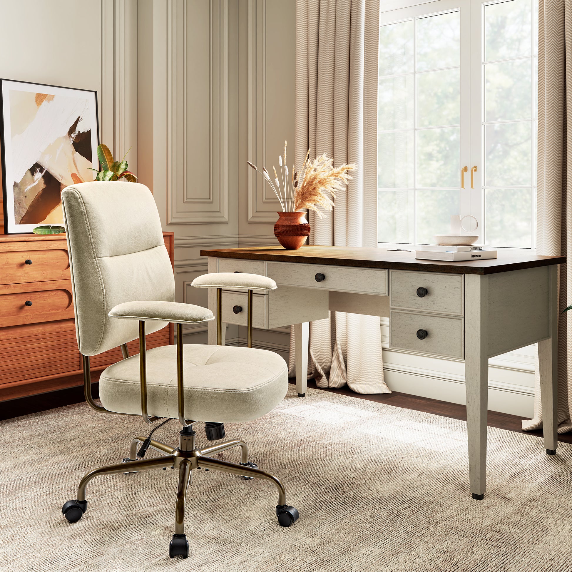 Eureka Ergonomic Becky cream faux suede office chair with bronze legs in a home office, next to a wooden desk and dresser.