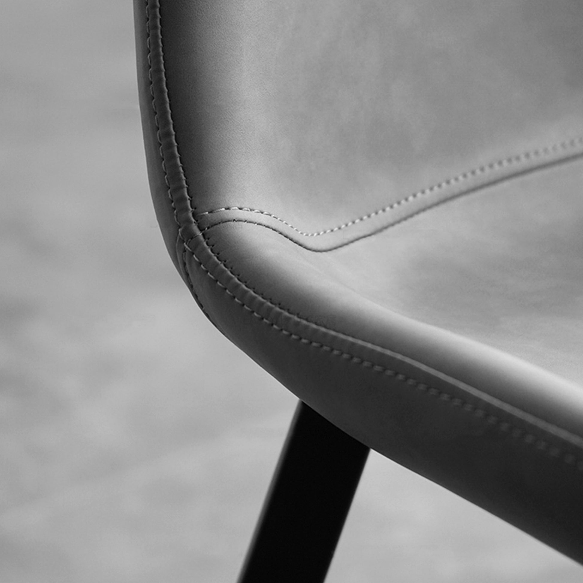Milo Dining Side Chair, Gray Synthetic Leather With Stitched Detail, Black Metal Legs.