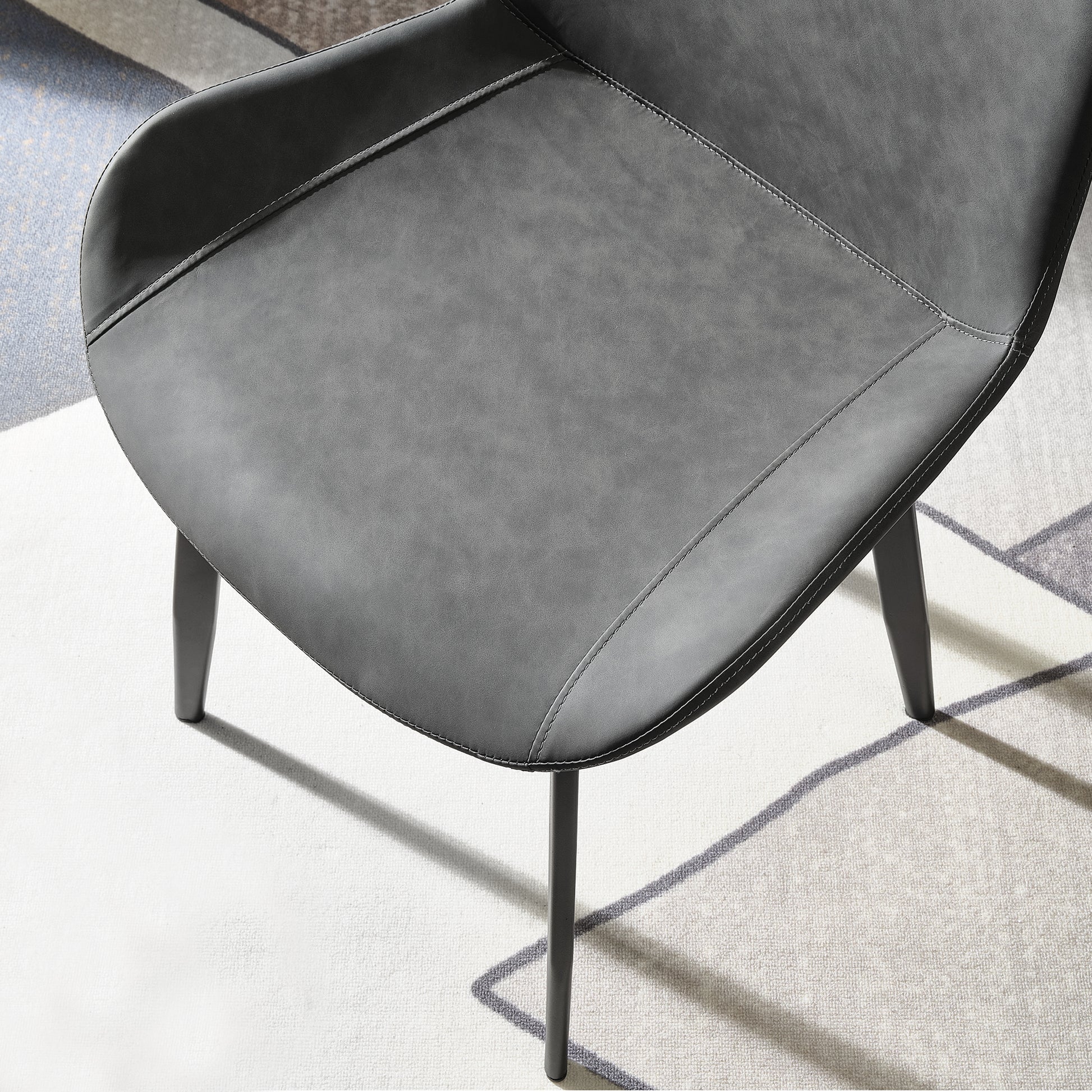 Milo Dining Side Chair in Gray. Modern Dining Room Chair With Black Metal Legs and Stitched Gray Upholstery.