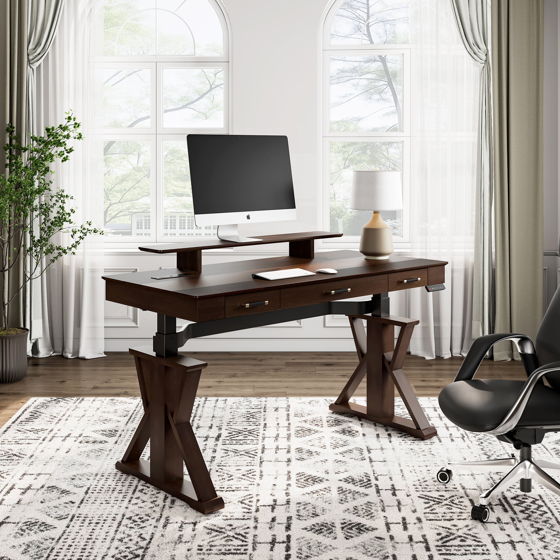 Ark Sws Pro Executive Standing Desk: Dark Brown, X-Shaped Legs, Monitor, Modern Office Setup.
