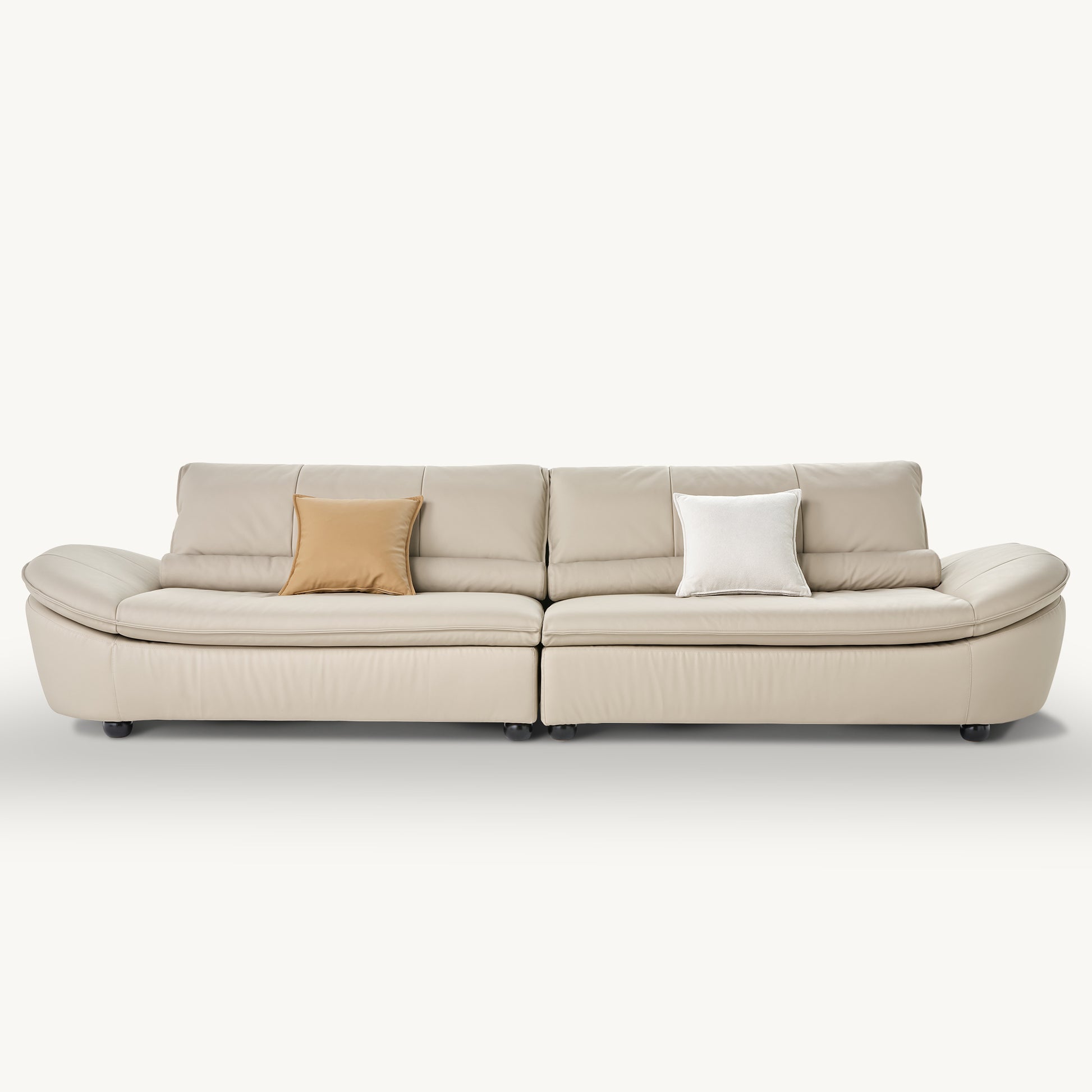 Bella Beige Napa Leather Sofa With Ergonomic Design and Throw Pillows.