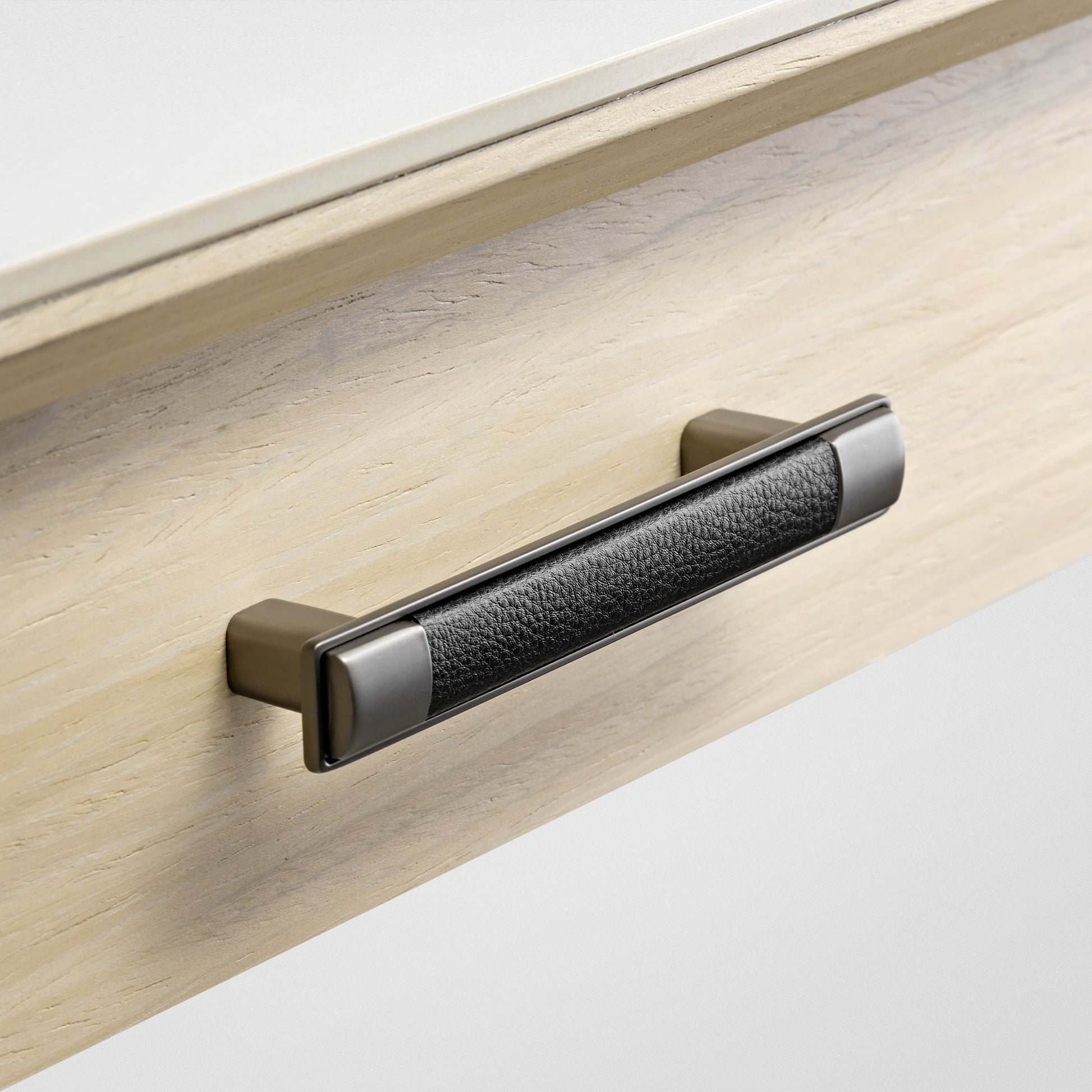 Eureka Ergonomic Ark Pro Desk Drawer Handle Detail: Black Leather Grip and Wood Grain Accent, Luxury Desk Design.