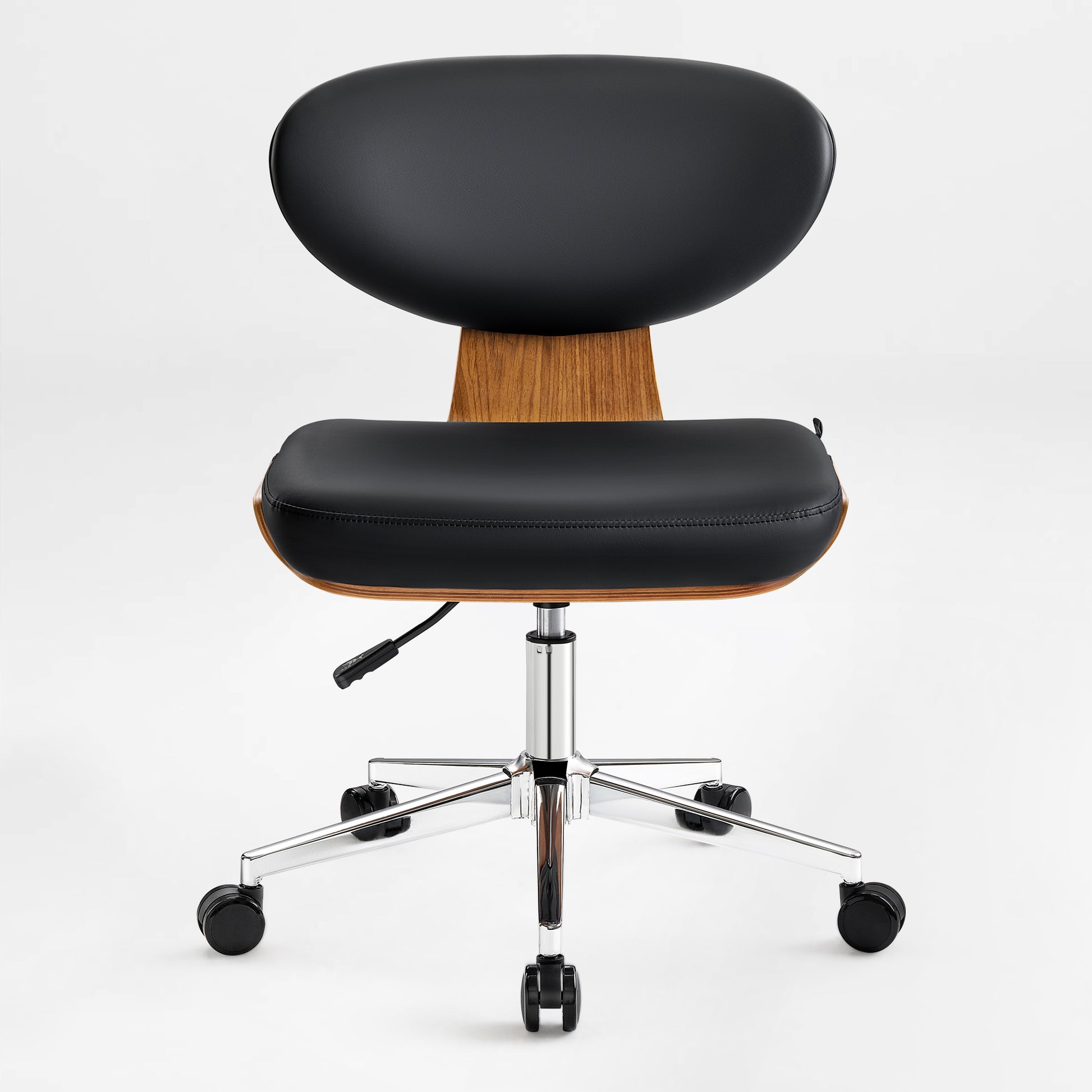 Eureka Ergonomic Matt black faux leather office chair with curved walnut veneer shell, chrome base, and casters, showcasing design.