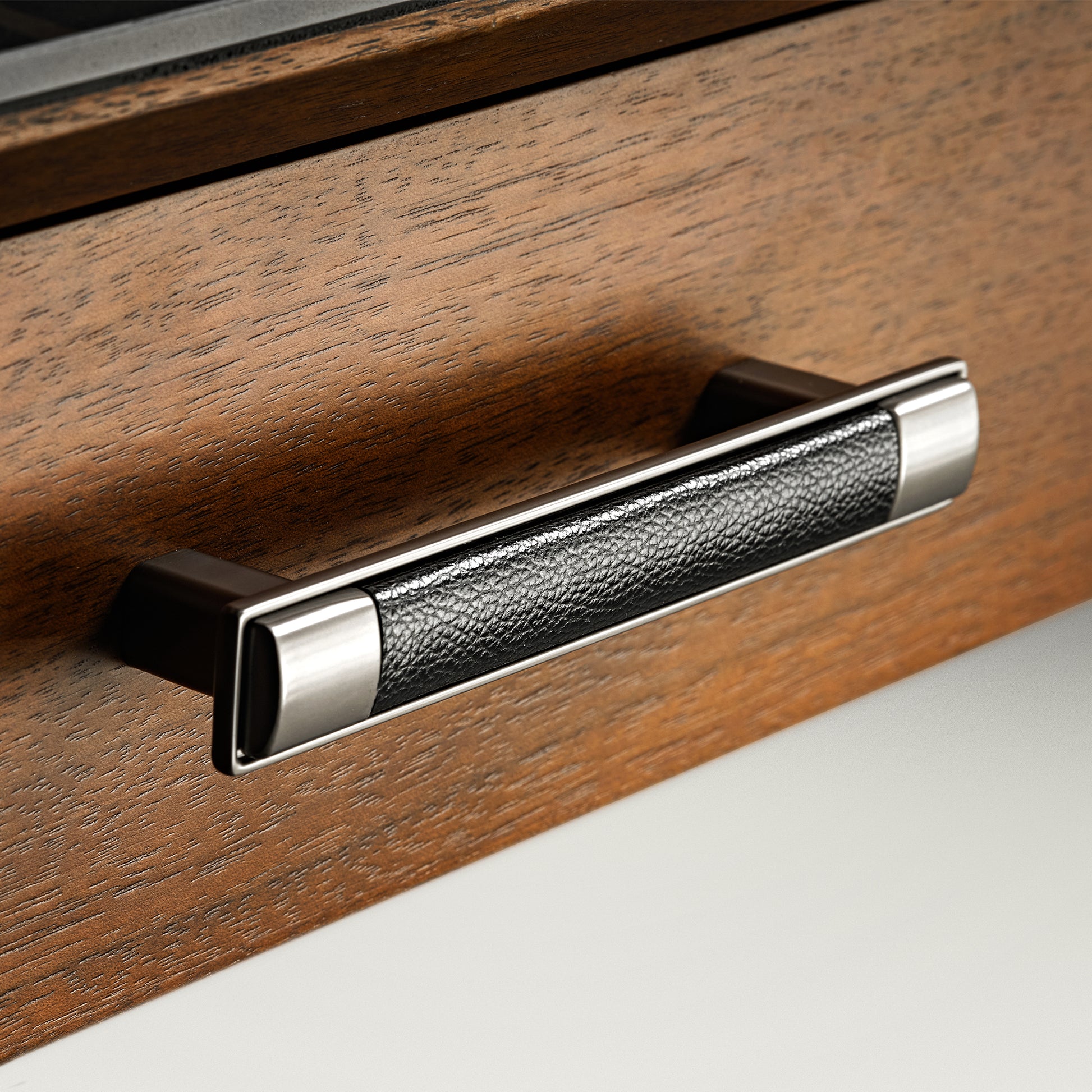 Eureka Ergonomic Ark Pro Desk Drawer Handle With Black Leather Grip and Wooden Drawer Detail.