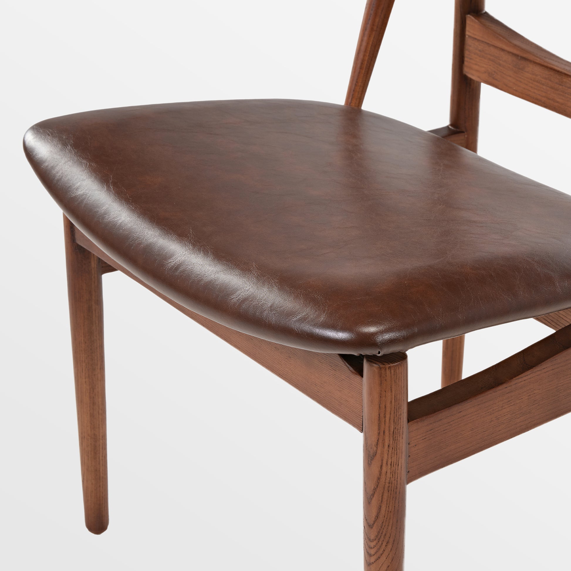 Brown Leather Dining Chair Detail. Mid-Century Modern Solid Wood Dining Chair.
