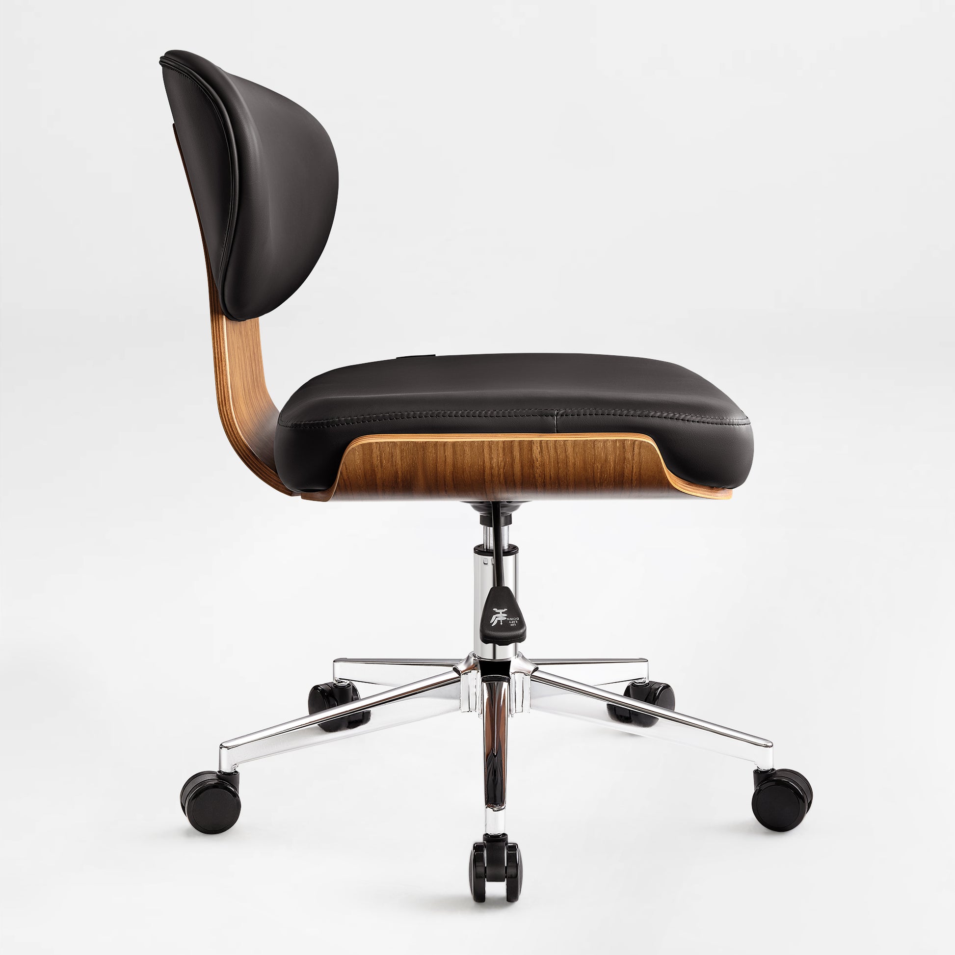 Eureka Ergonomic Matt black faux leather office chair with curved walnut veneer shell, chrome base, and casters, side view.