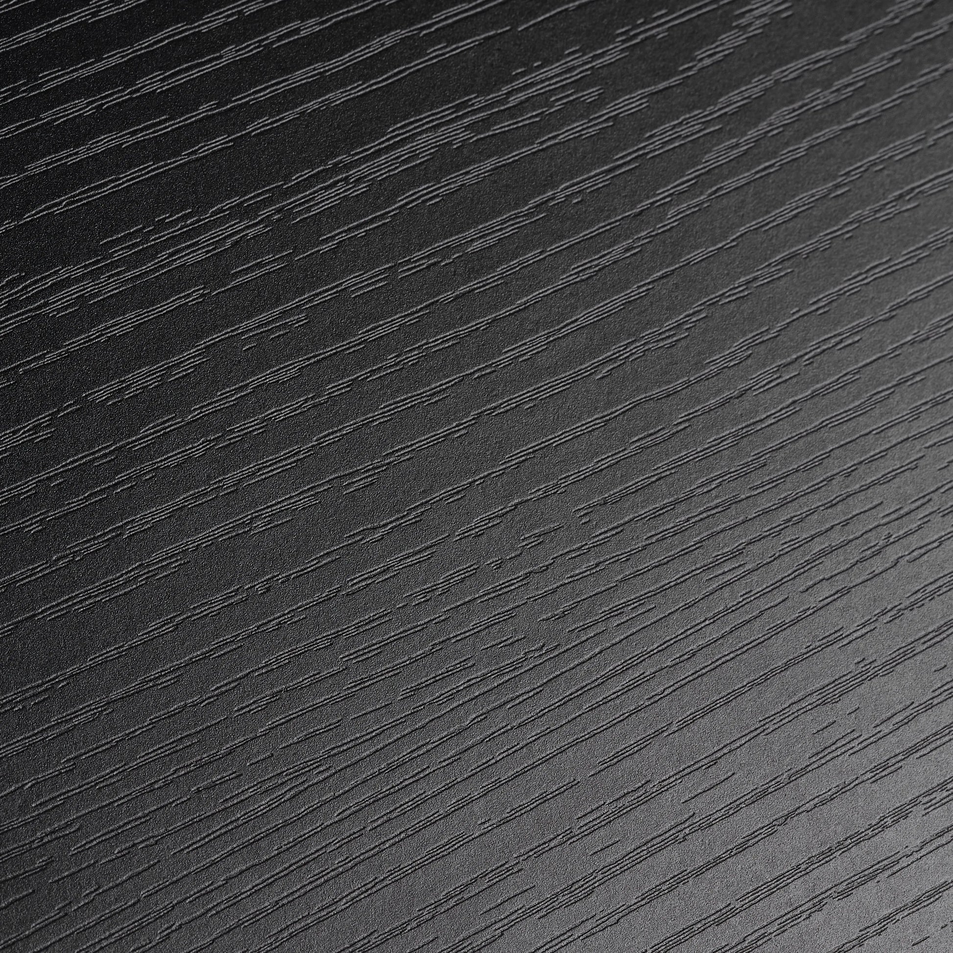 Close-Up Detail of Black Wood Grain Finish, Standing Desk Surface.