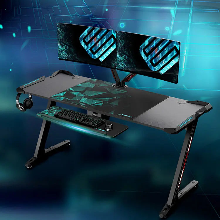 Eureka Ergonomic Gaming Desk With Ergonomic Design, Black Frame, and Dual Monitors Setup.