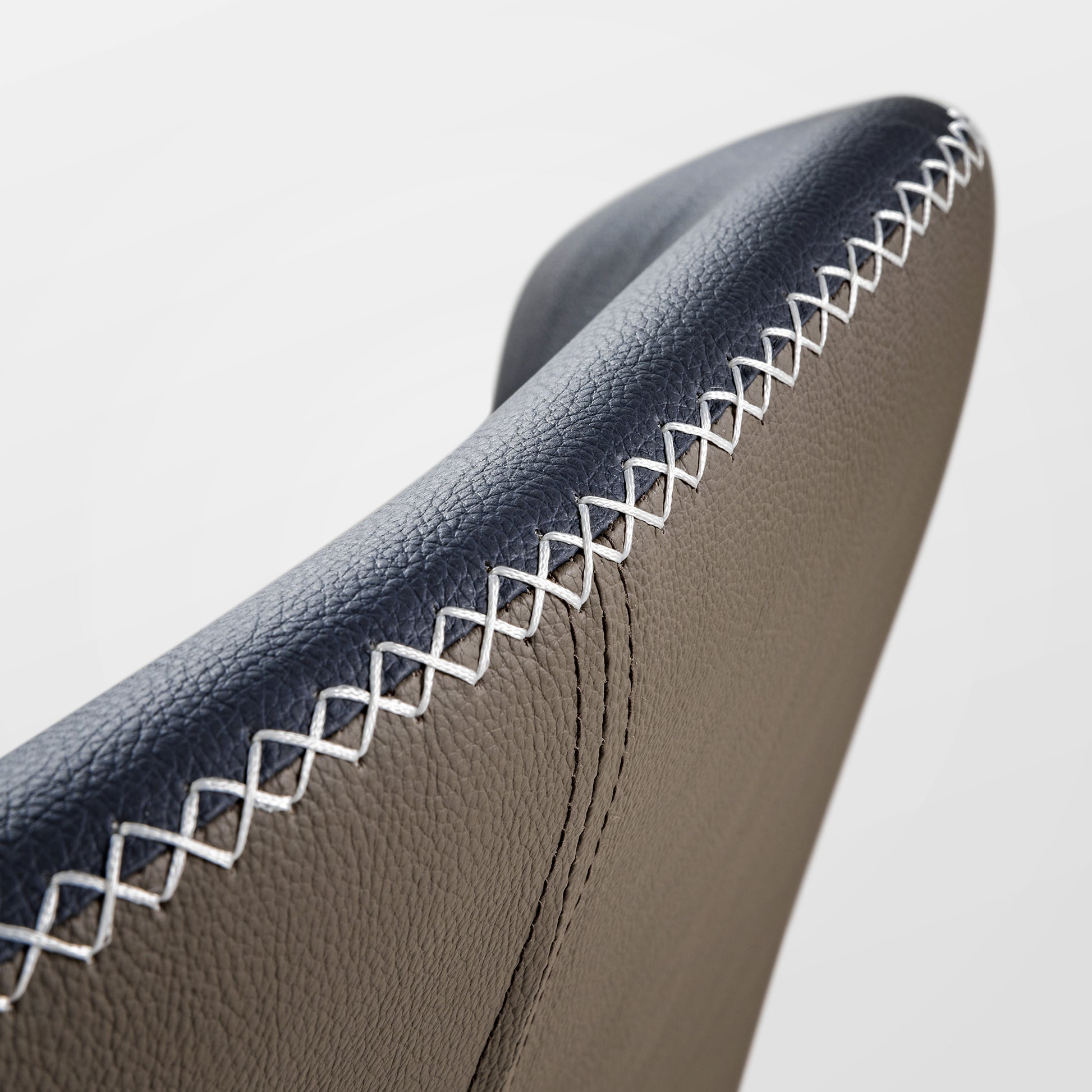 Elysian Blue Dining Chair Detail, Close-Up On the Gray Pu Leather Backrest With White Stitch.