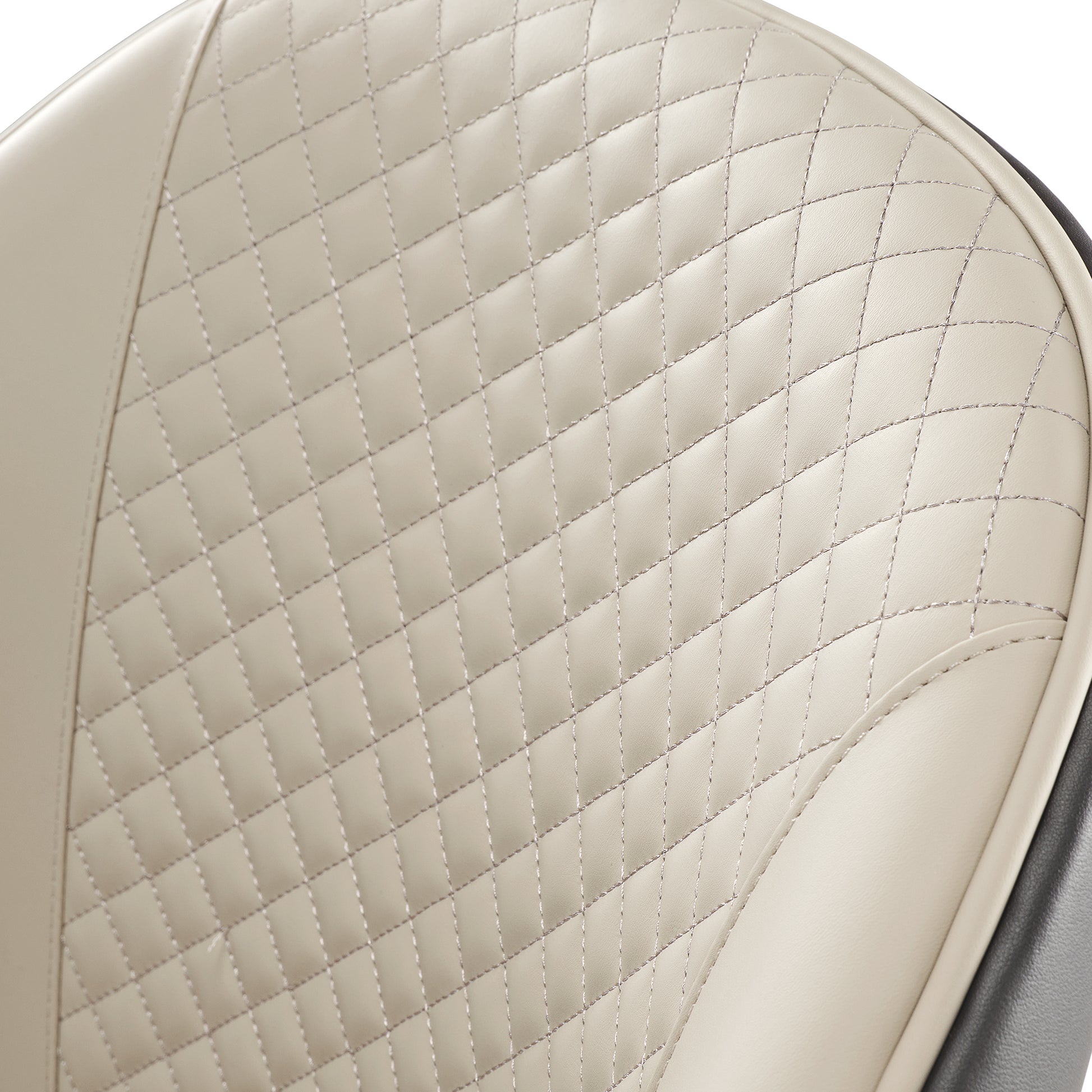 Anareli Dining Chair Detail: Beige Diamond-Stitched Faux Leather Backrest With Silver Stitching and Dark Brown Trim.