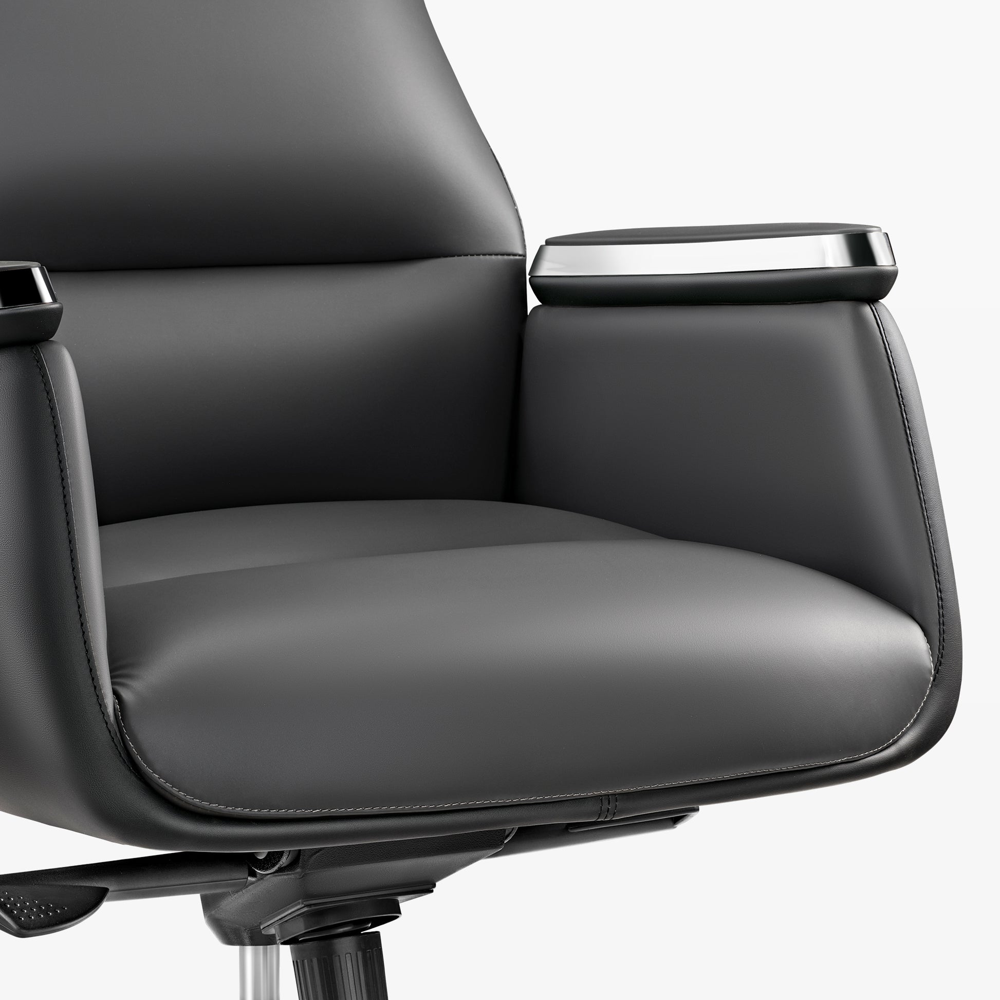 Royal II Executive Office Chair Detail: Black Leather Armrest With Silver Trim and Ergonomic Design.