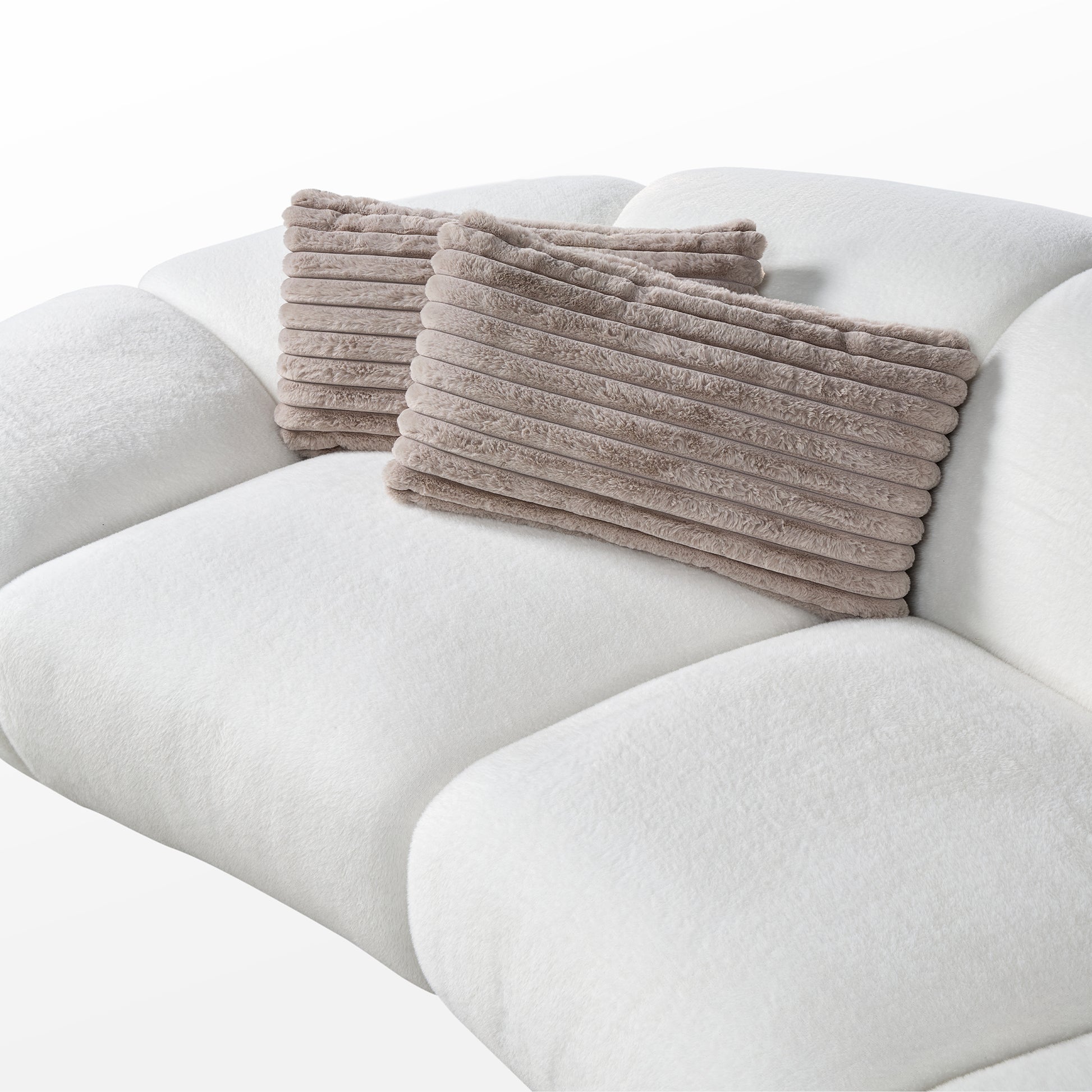 Adele Modern Curved Sofa With Beige Pillows, White Plush Fabric, Comfortable Living Room Sofa Detail.