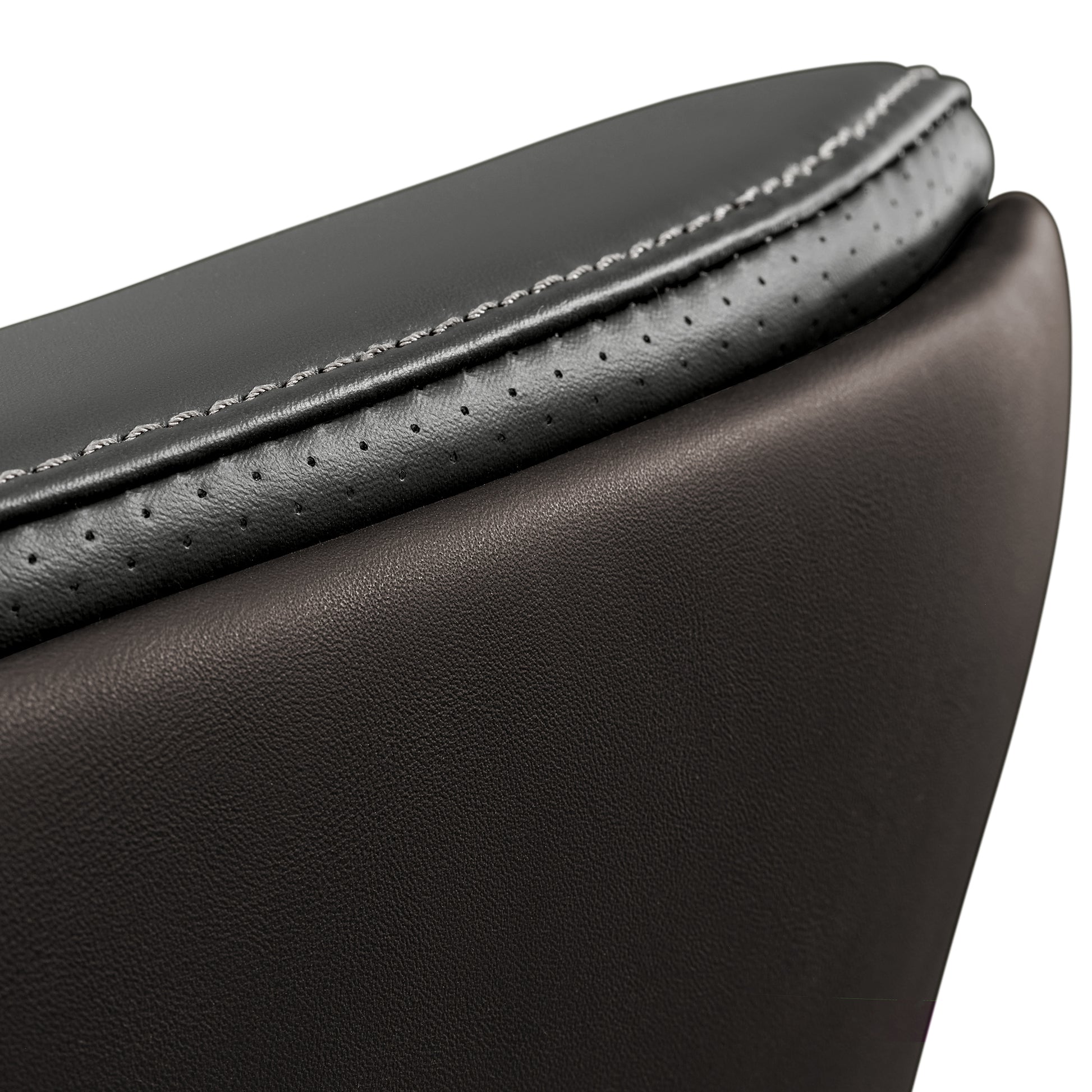 Eureka Ergonomic Close-up of Royal Slim executive chair seat cushion, showcasing champagne leather texture, perforation detail, and stitching.