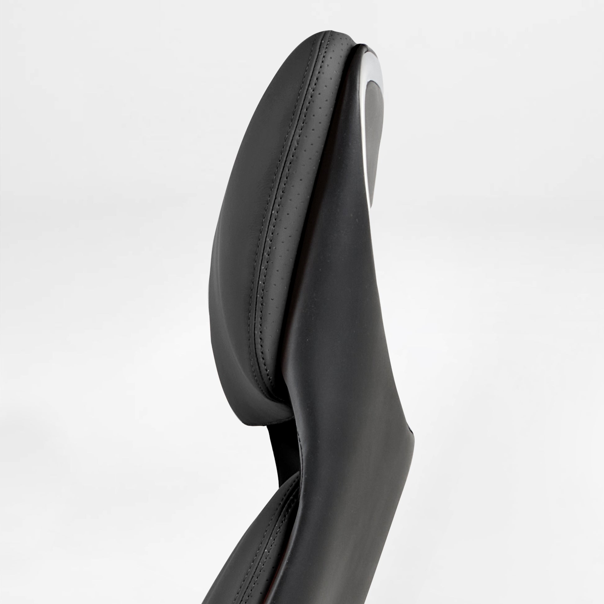 Eureka Ergonomic Serene black Napa leather executive chair headrest: perforated leather, smooth leather, contrast stitching, chrome trim.