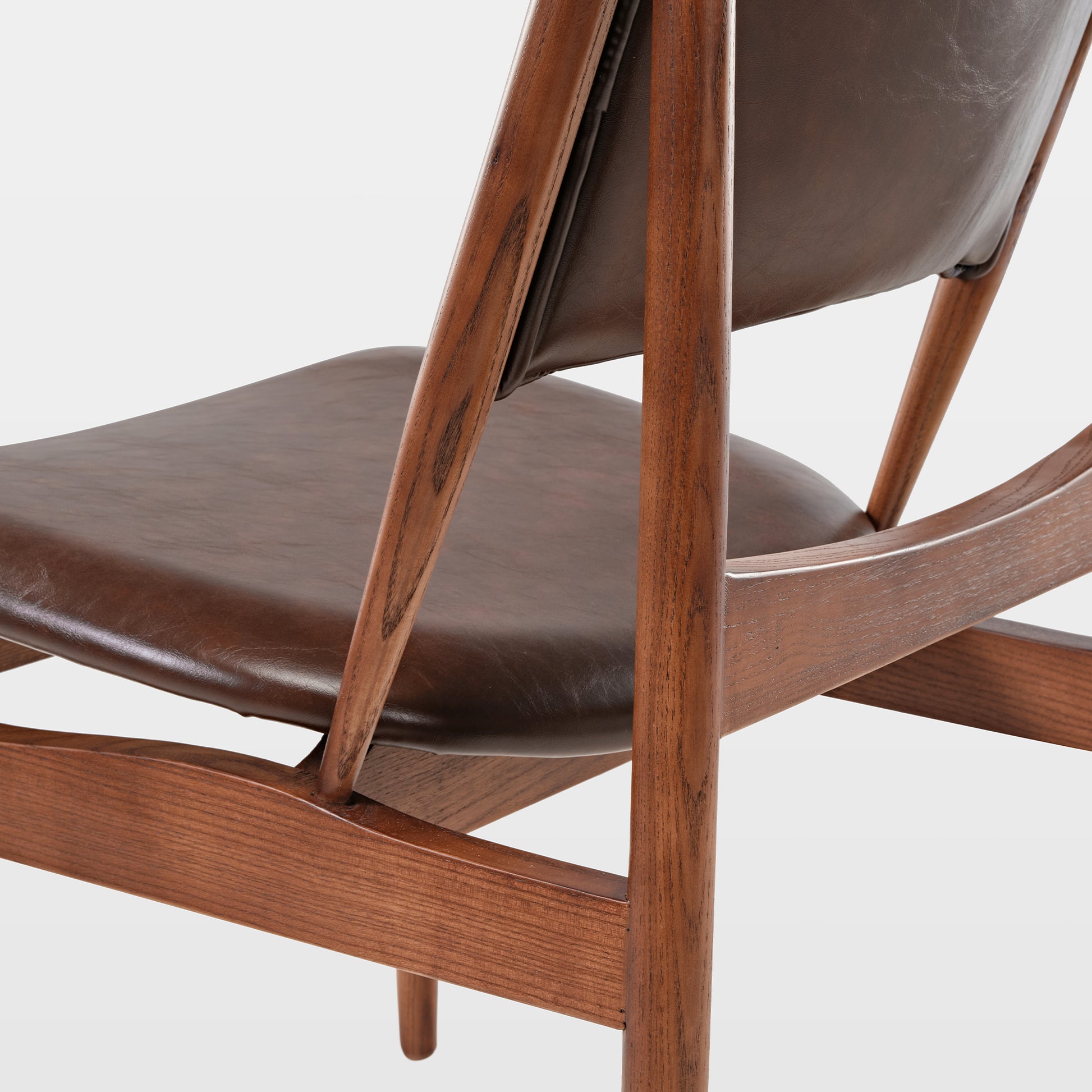 Brown Leather Dining Chair Detail, Mid-Century Modern Design, Ash Wood Frame.