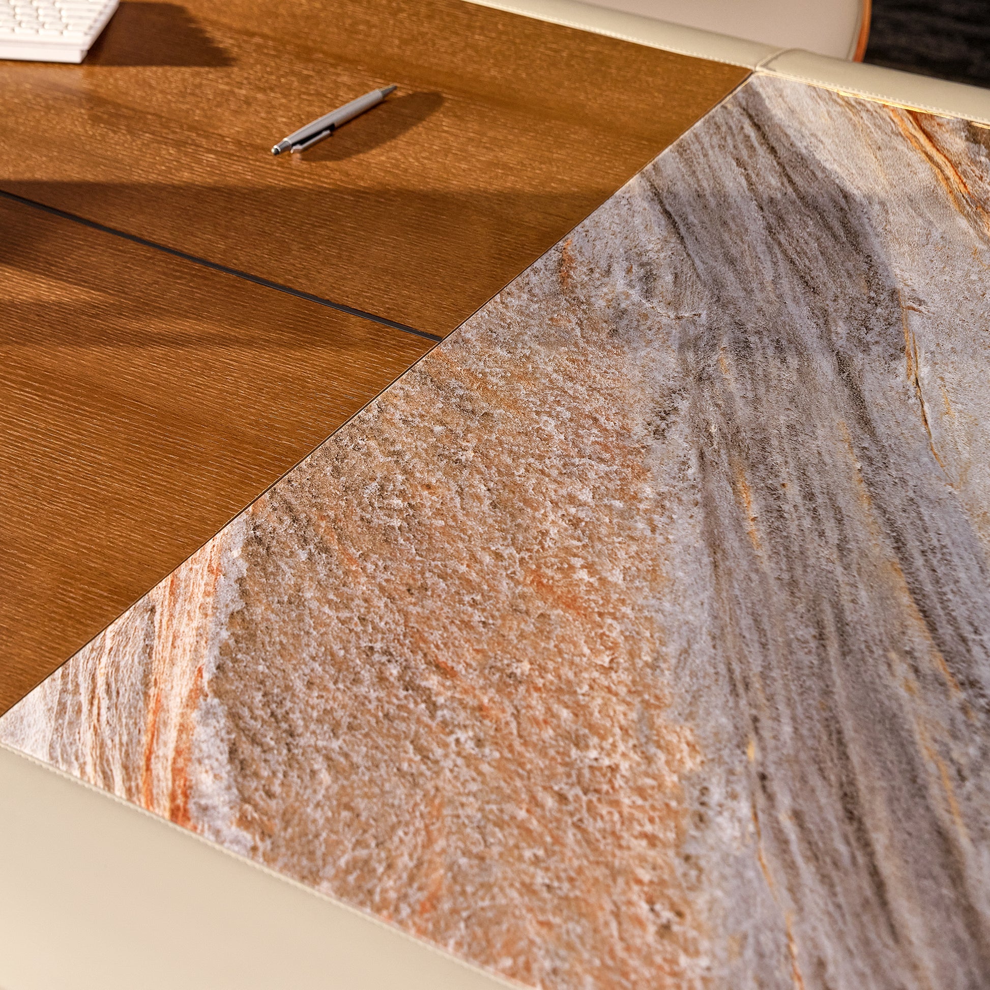 Eureka Ergonomic Zen Lunar desk close-up showing warm wood grain next to earthy marble inlay with elegant veining.
