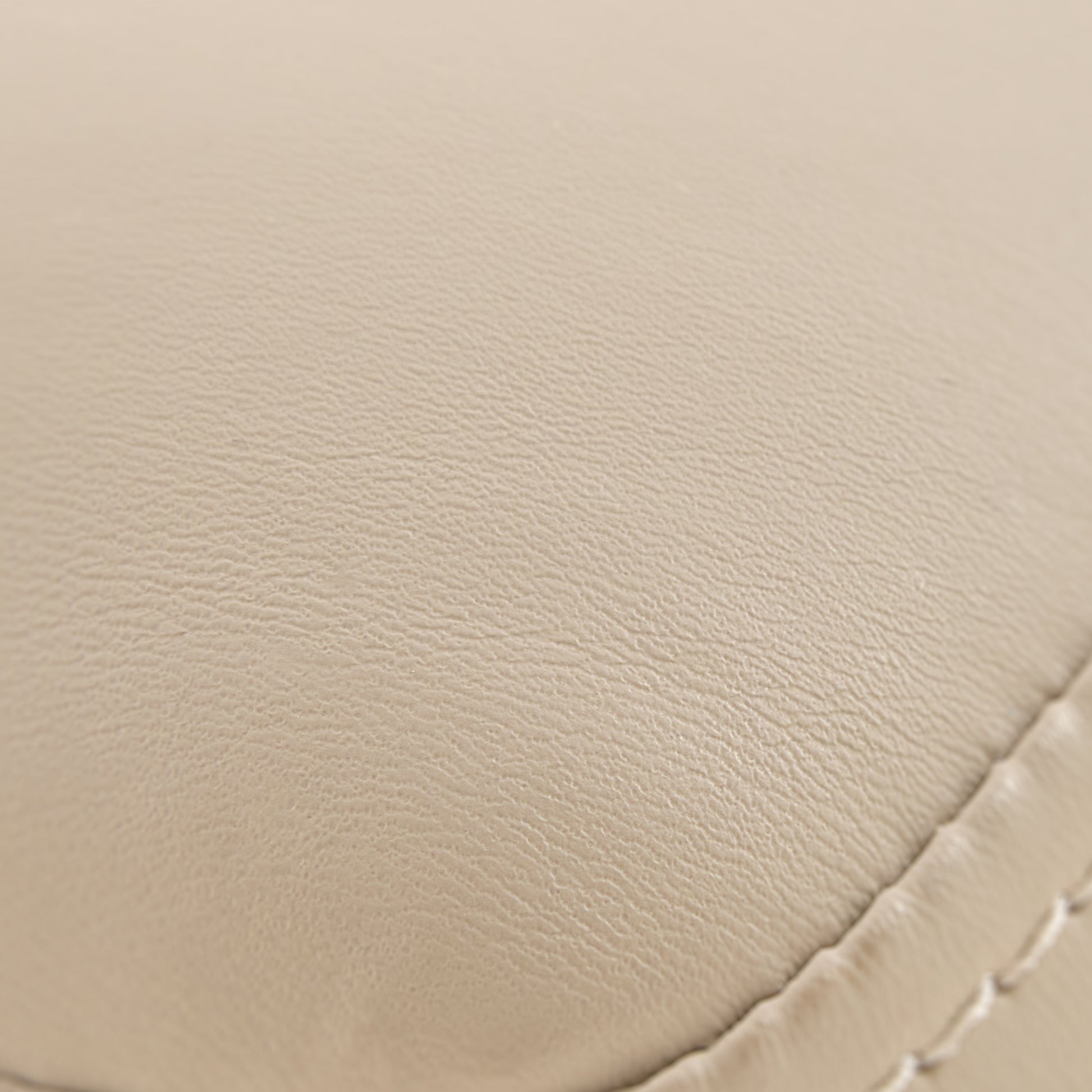 Off-White Pu Leather Upholstery Detail, Chester Dining Chair, Textured Surface.