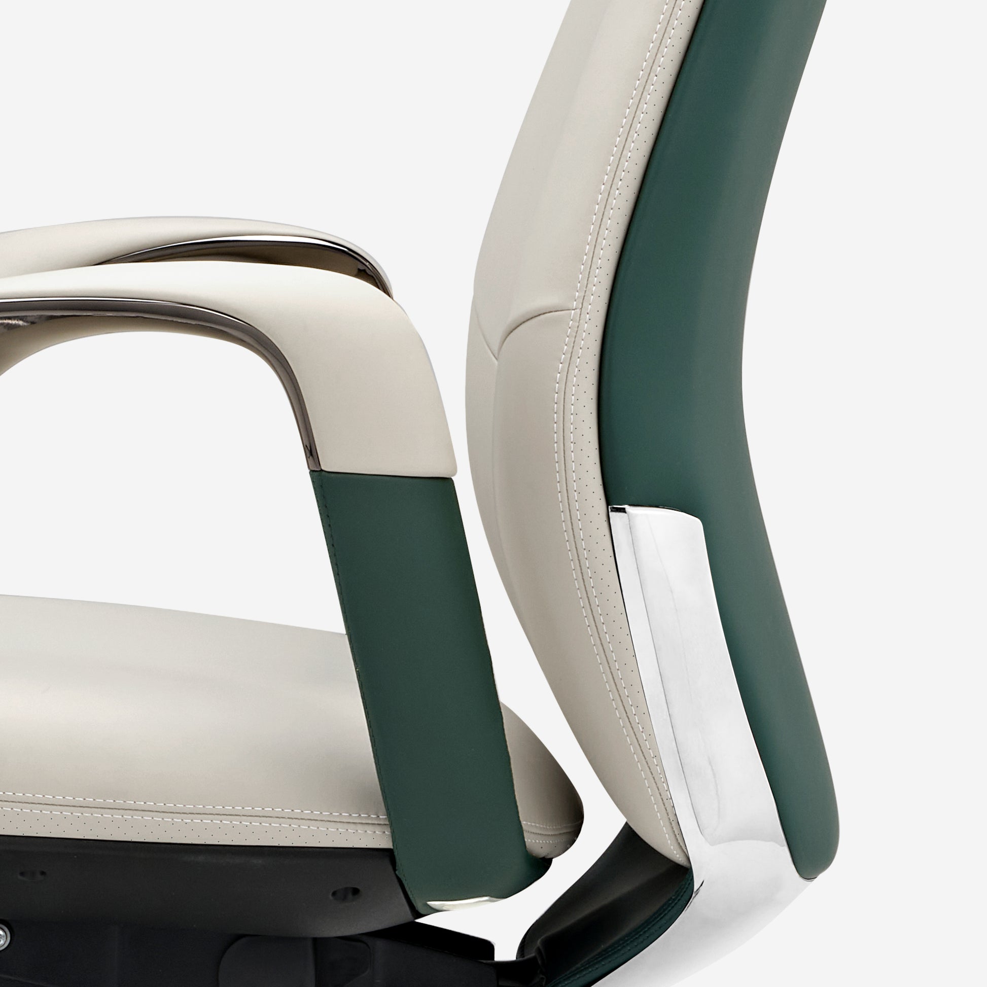 Serene Executive Office Chair Detail: Cream Napa Leather With Dark Green Accents and Metal Trim.