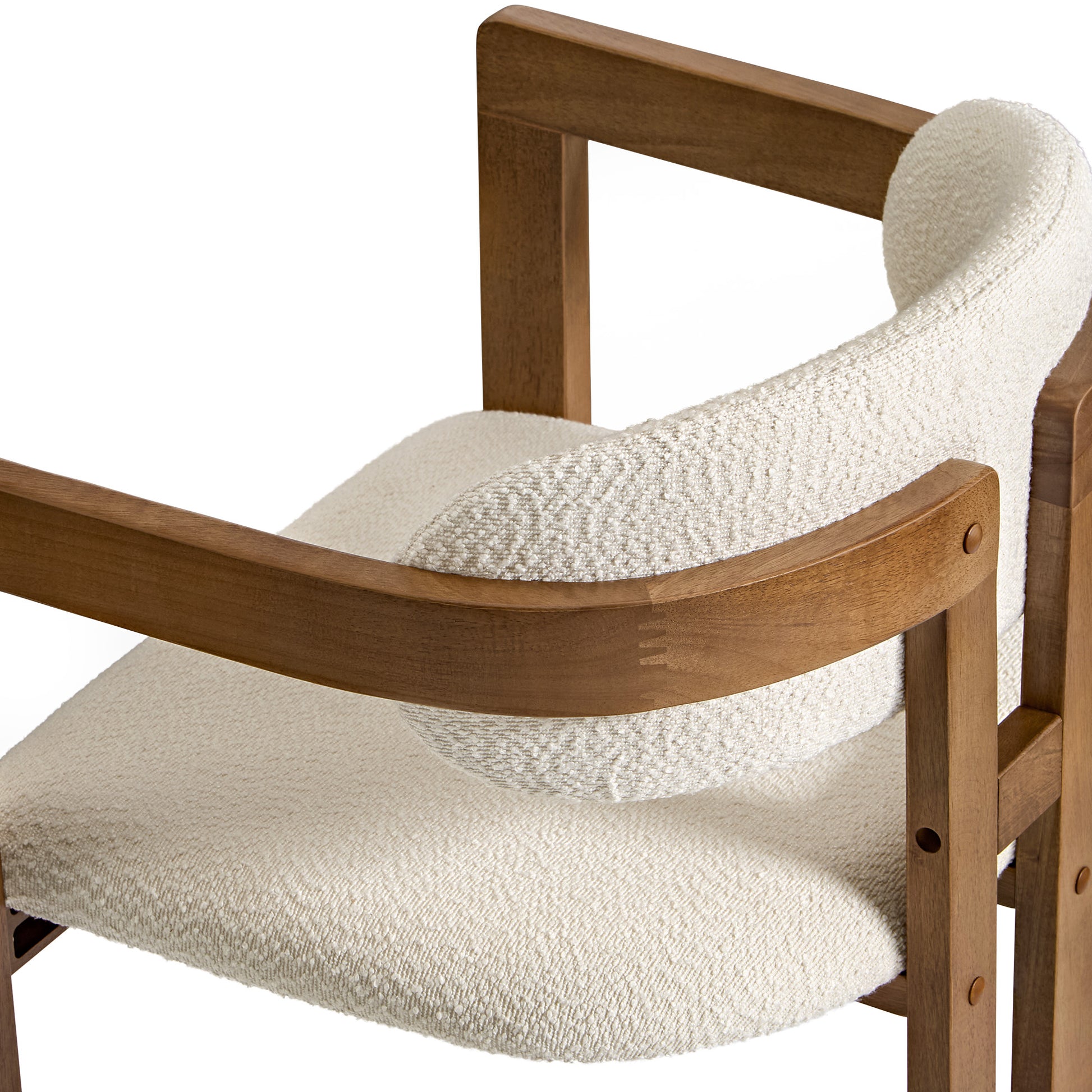 Eureka Ergonomic Close-up of Elle bouclé dining chair in ivory with walnut wood frame, mid-century modern design.