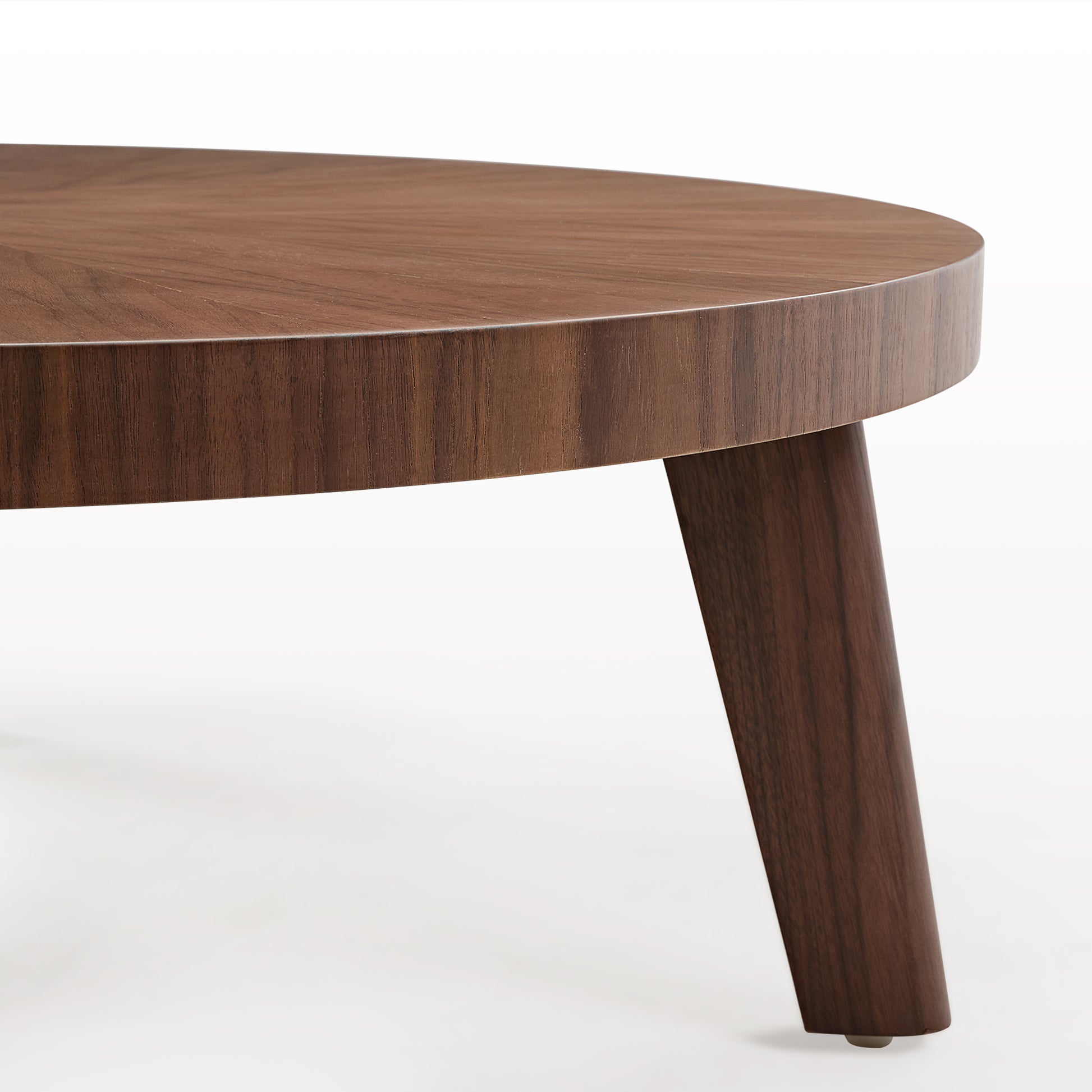 Close-Up of a 41 Walnut Coffee Table Edge and Leg. Showing Wood Grain Detail.