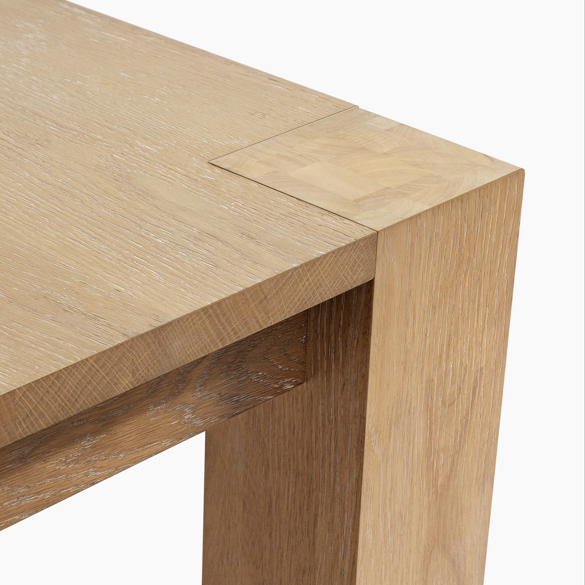 Edora Oak Dining Table Detail, Oak Veneer, Close-Up of Wood Grain and Joint.