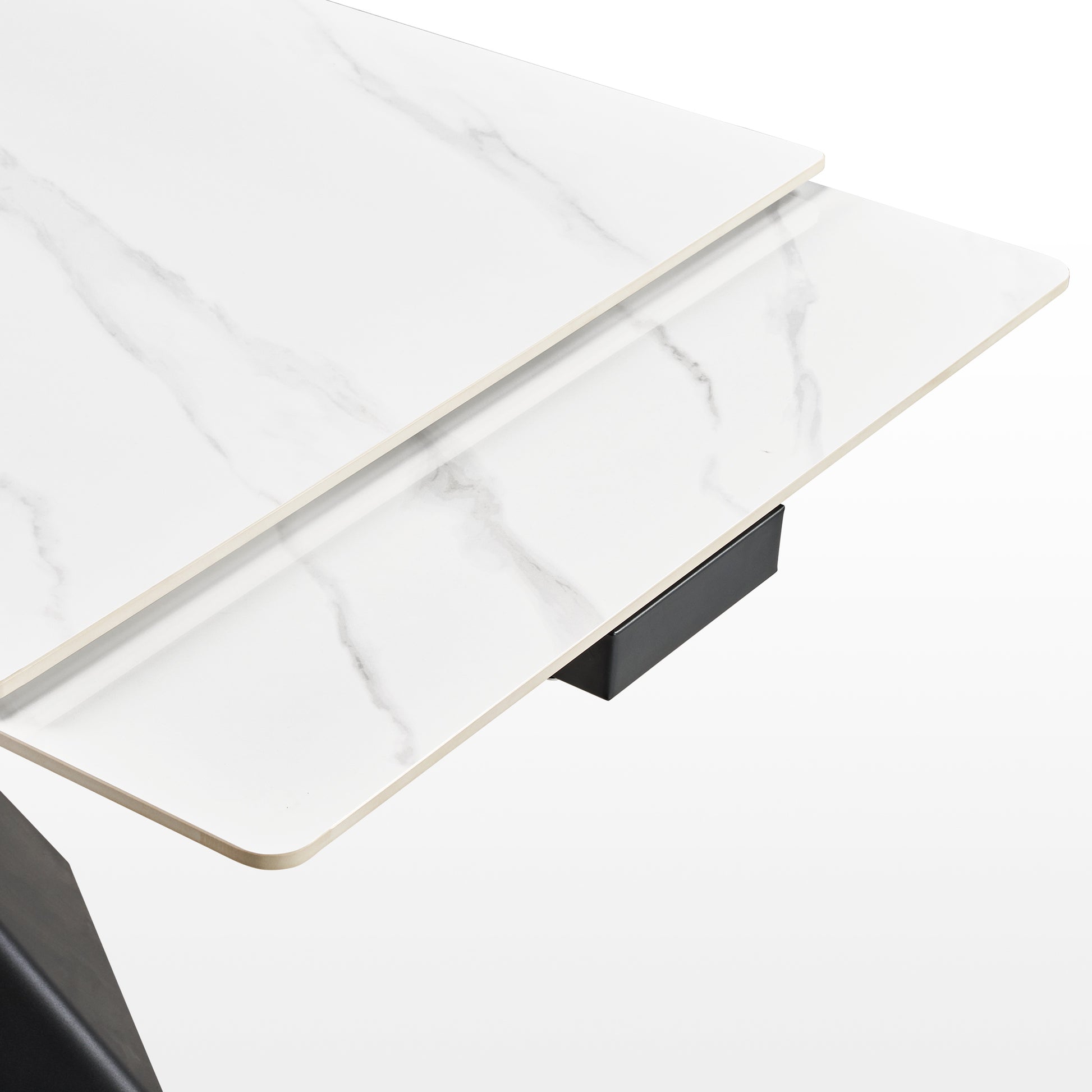 Evelyn Extendable Dining Table Detail Showing White Sintered Stone Surface and Extending Mechanism.
