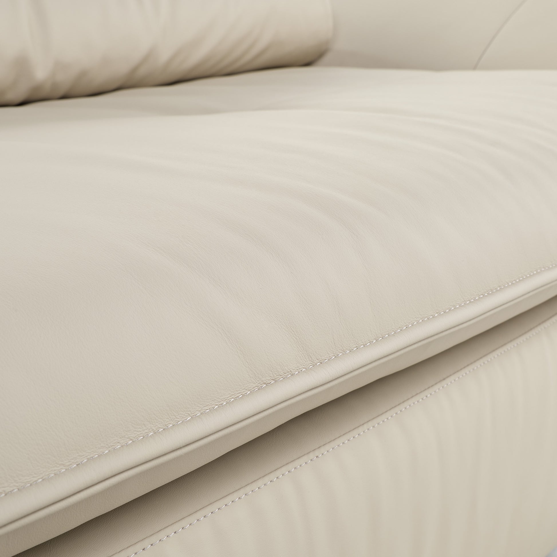 Bella Beige Napa Leather Sofa Detail, Showcasing Leather Texture and Stitching.