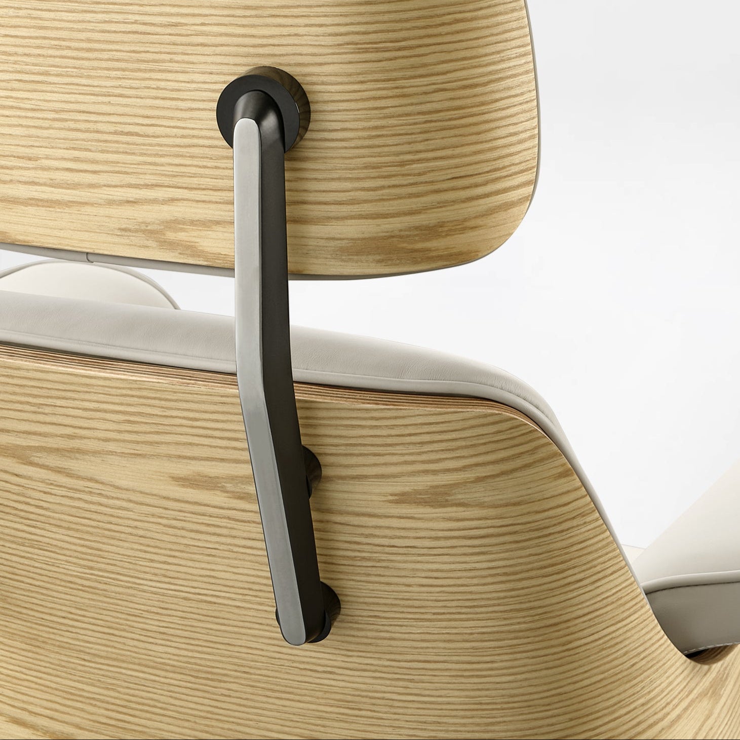 Eureka Ergonomic Close-up of Mathias light beige Napa leather executive chair headrest adjustment mechanism with wood veneer shell.