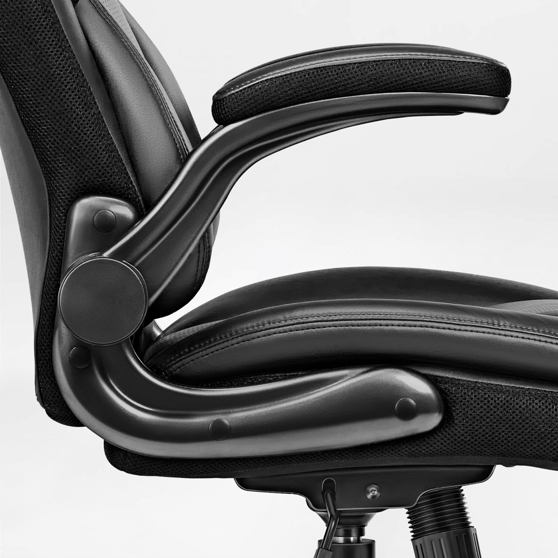 Eureka Ergonomic Galene cream faux leather ergonomic office chair armrest and seat detail with mesh panels and stitching.