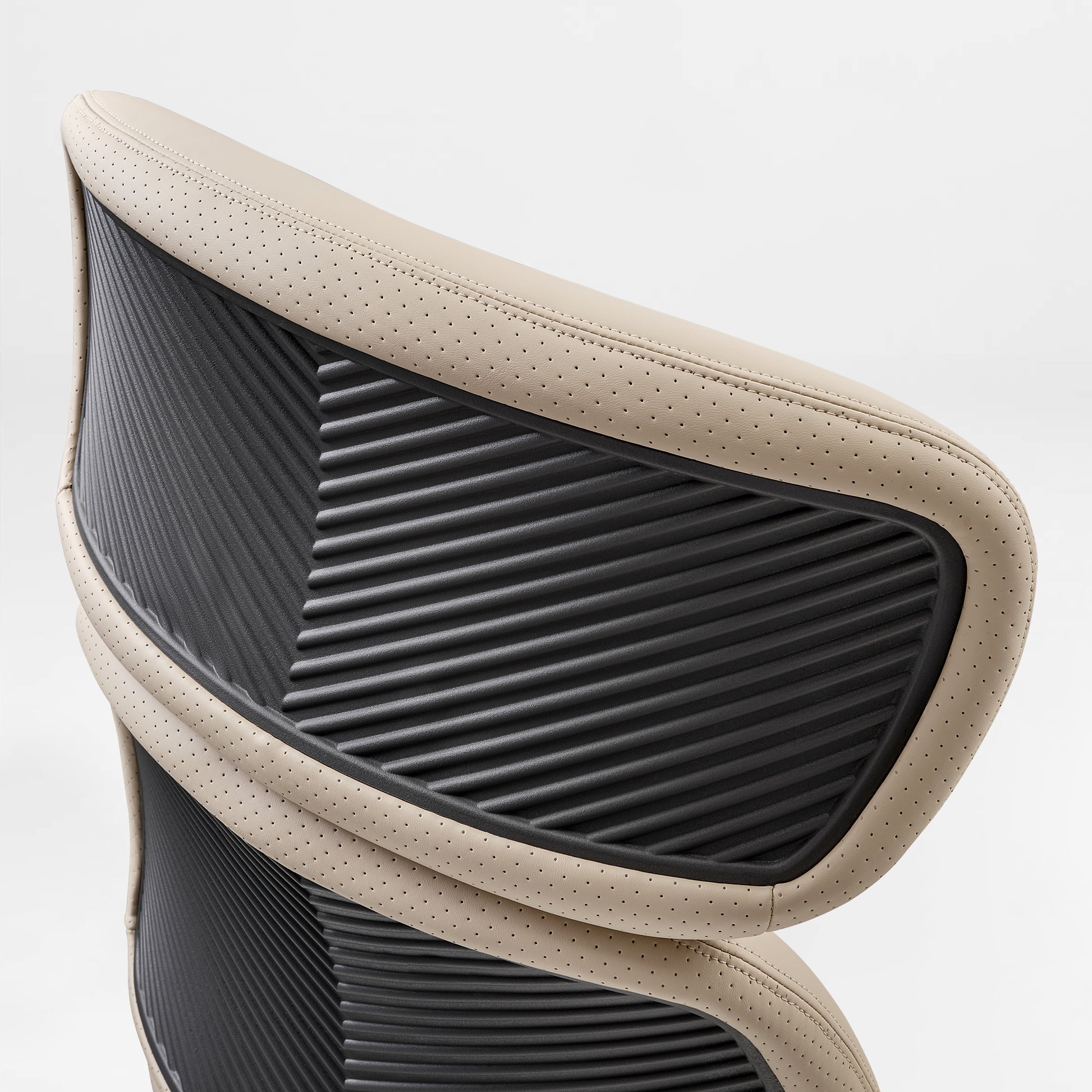 Eureka Ergonomic Close-up of beige Royal Rowan executive chair showing perforated microfiber leather and ribbed black backrest detail.