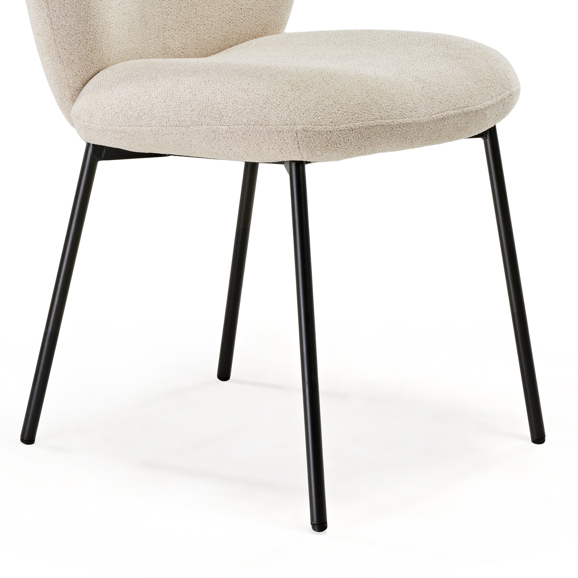 Sage Dining Chair Detail: Off-White Upholstered Seat With Black Metal Legs. Modern, Minimalist Design.