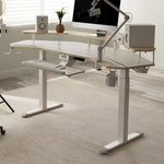 Eureka Ergonomic Aero Pro Wing-Shaped Standing Desk Setup, Showing Monitor, Speakers, Keyboard, and Accessories.