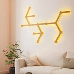 Soho Art Lighting: Modern Wooden Wall Light Fixture With Warm Yellow Glow Above Beige Sofa in a Living Room Setting.