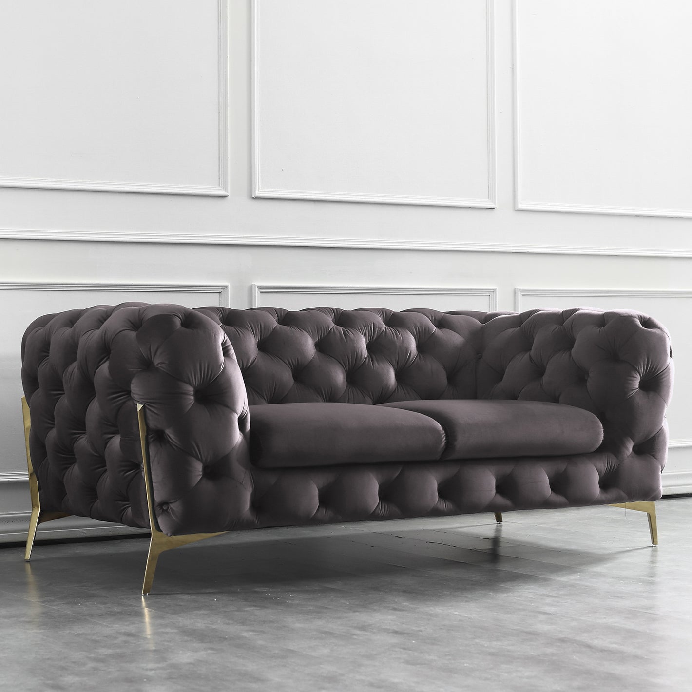 Beverly Loveseat Sofa With Navy Velvet Upholstery and Rose Gold Legs.