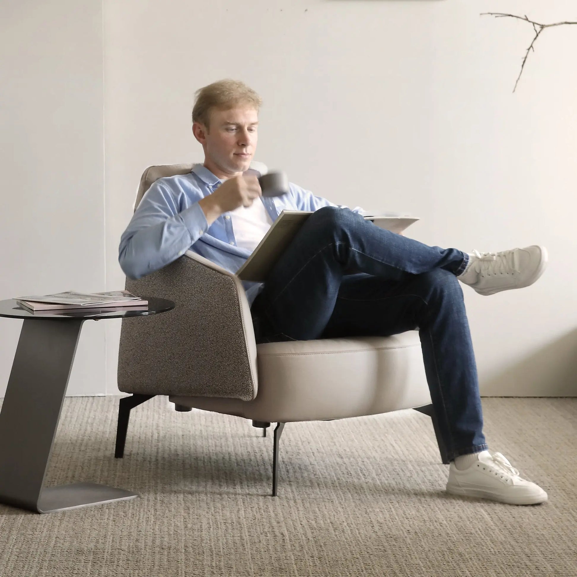 Ivory Napa Leather Lounge Chair With Man Relaxing, Ergonomic Design for Living Room.