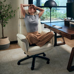 Woman Relaxing in Royal Microfiber Leather Executive Office Chair. Ergonomic Design for Comfort.