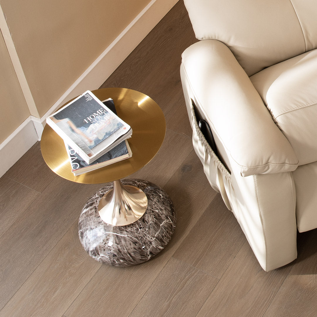 15 Round Side Table With Gold Top and Marble Base Next to a Cream Leather Recliner Sofa, Modern Home Interior.